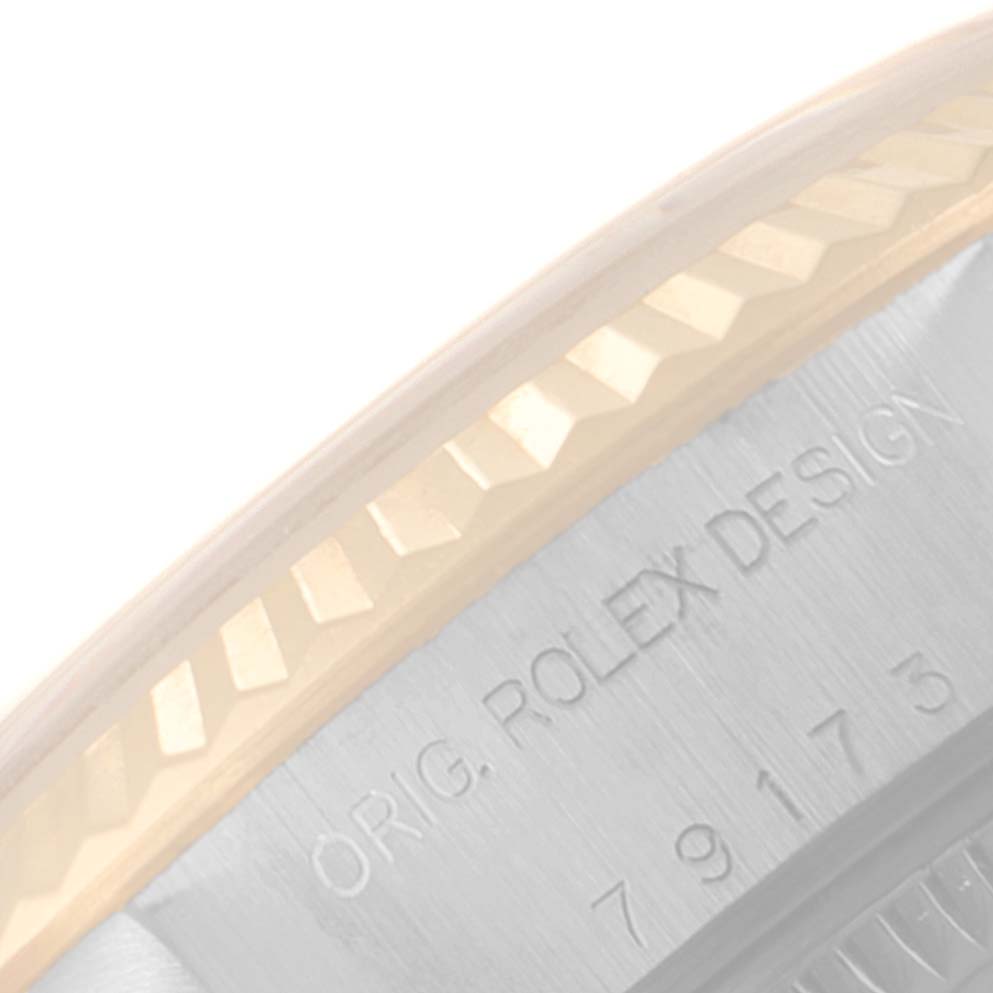 This image shows a close-up of the bezel and engraving on a Rolex Datejust 79173 Women
s Steel and Gold (two tone) Silver Dial 79173 Women
s Steel and Gold (two tone) Silver Dial watch.