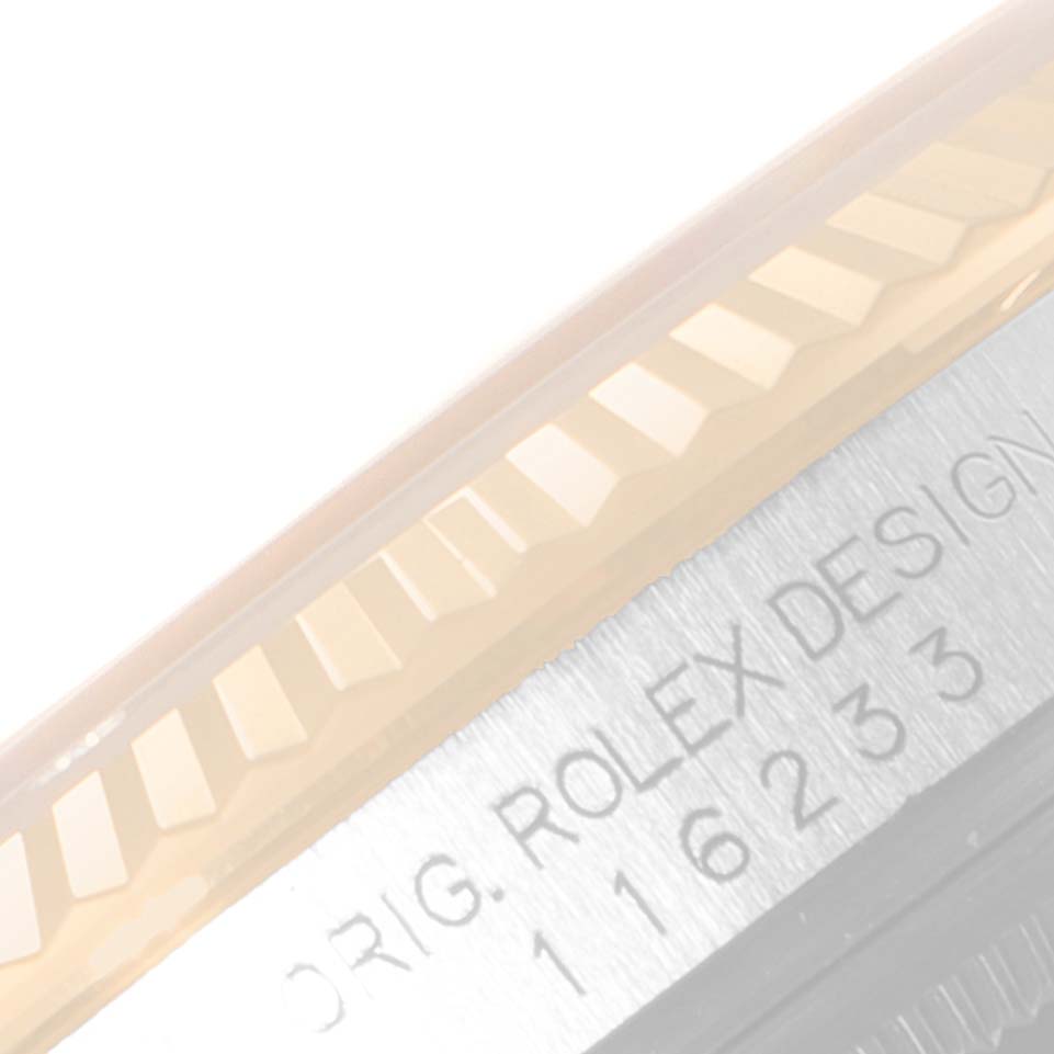 The image shows a close-up angle of the bezel and part of the casing with engraving on a Rolex Datejust 116233 Men's Steel and Gold (two tone) Silver Dial 116233 Men's Steel and Gold (two tone) Silver Dial model watch.