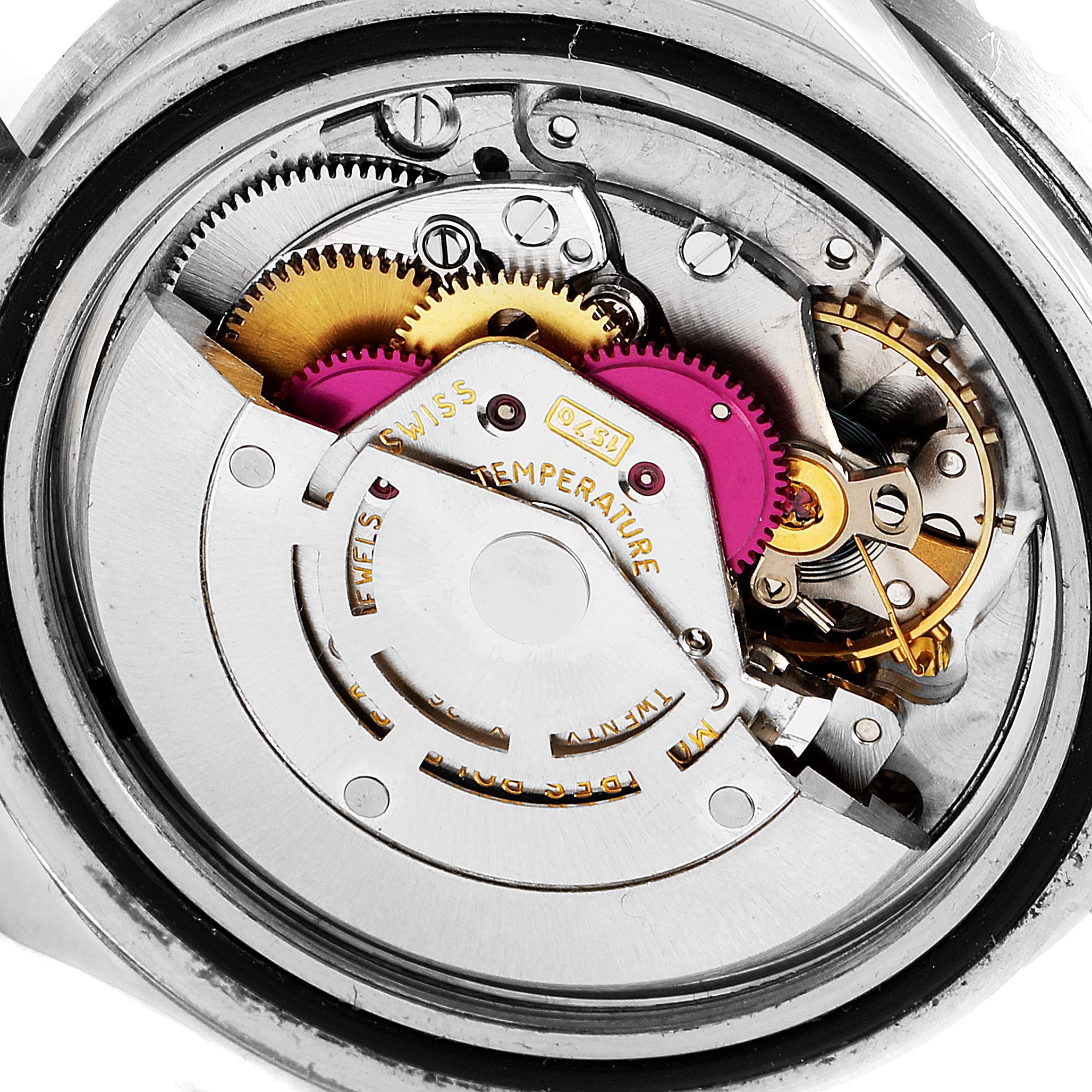 The image shows a close-up of the internal mechanism of a Rolex Vintage Collection 1675 Men's Stainless Steel Black Dial 1675 Men's Stainless Steel Black Dial watch.