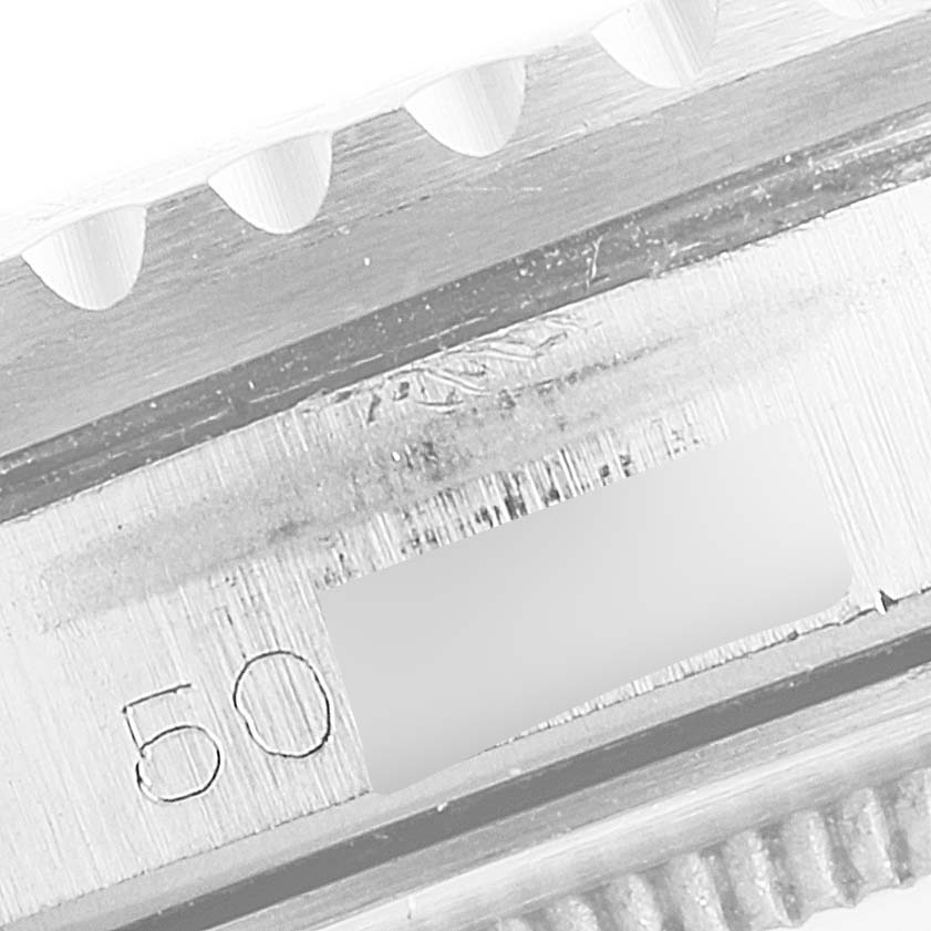 This image shows a close-up of the engraved serial number area on the casing of a Rolex Vintage Collection 1675 Men's Stainless Steel Black Dial 1675 Men's Stainless Steel Black Dial model watch.