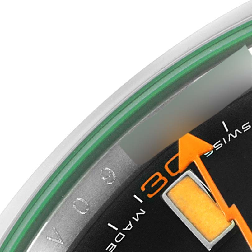 This close-up angle shows part of the face and orange second hand of a Rolex Milgauss 116400V Men's Stainless Steel Black Dial 116400V Men's Stainless Steel Black Dial watch.