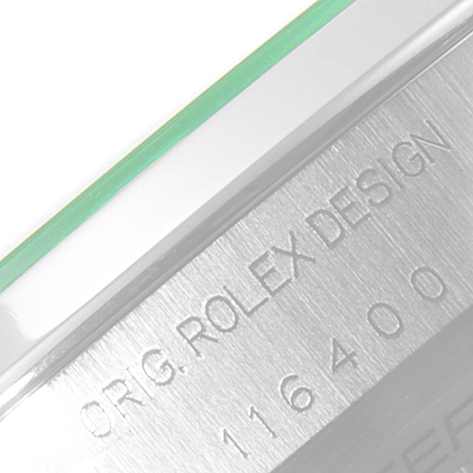 The image shows a close-up of the Milgauss Rolex model's case side with engraved markings.
