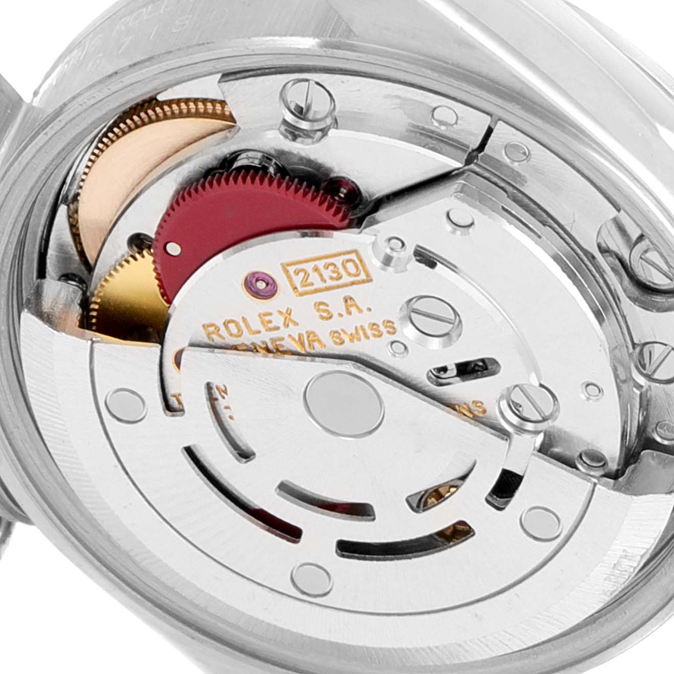 The image shows a close-up of the Oyster Perpetual Rolex watch movement, highlighting its internal mechanism.