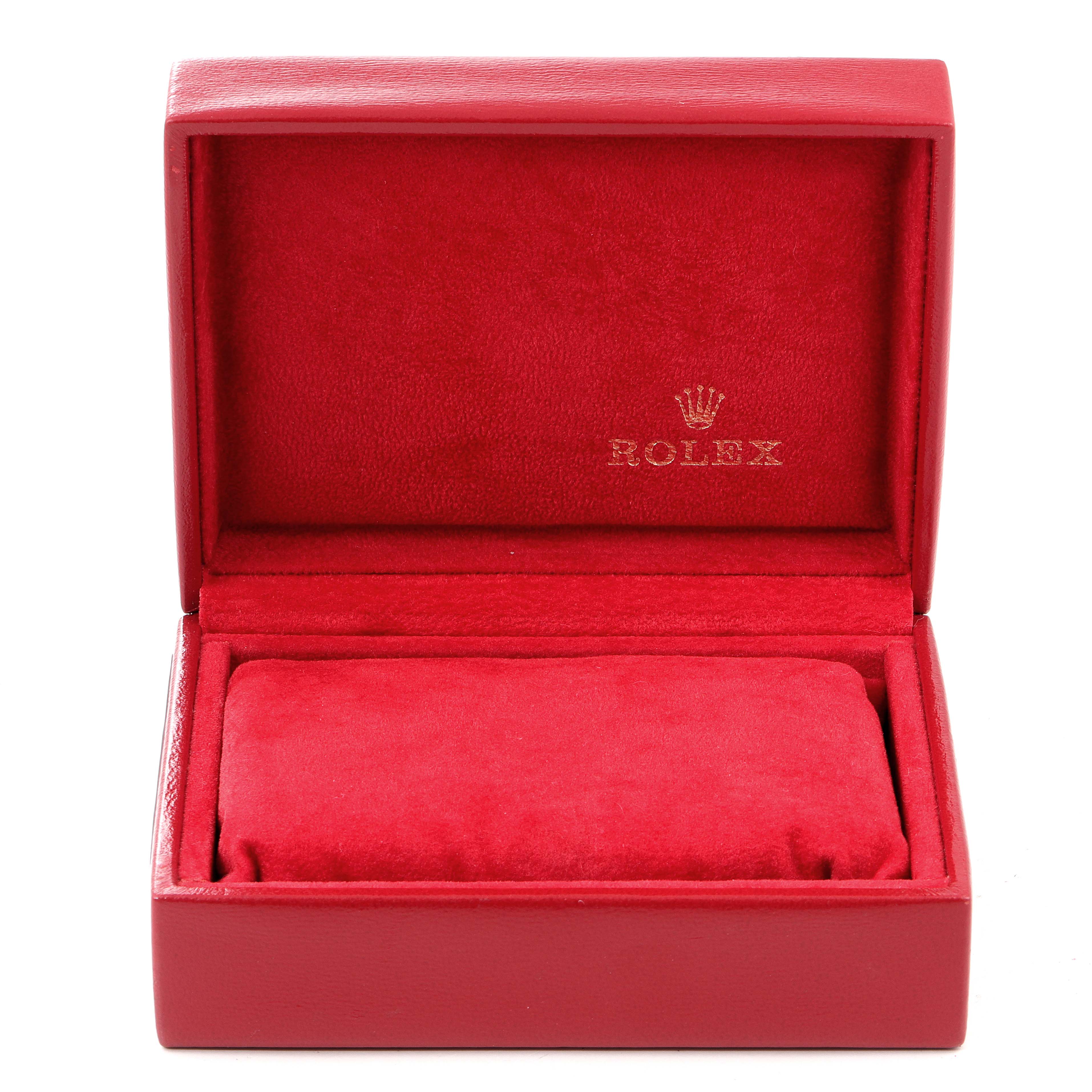 The image shows an open red Rolex watch box for the Oyster Perpetual model, with a cushion inside.
