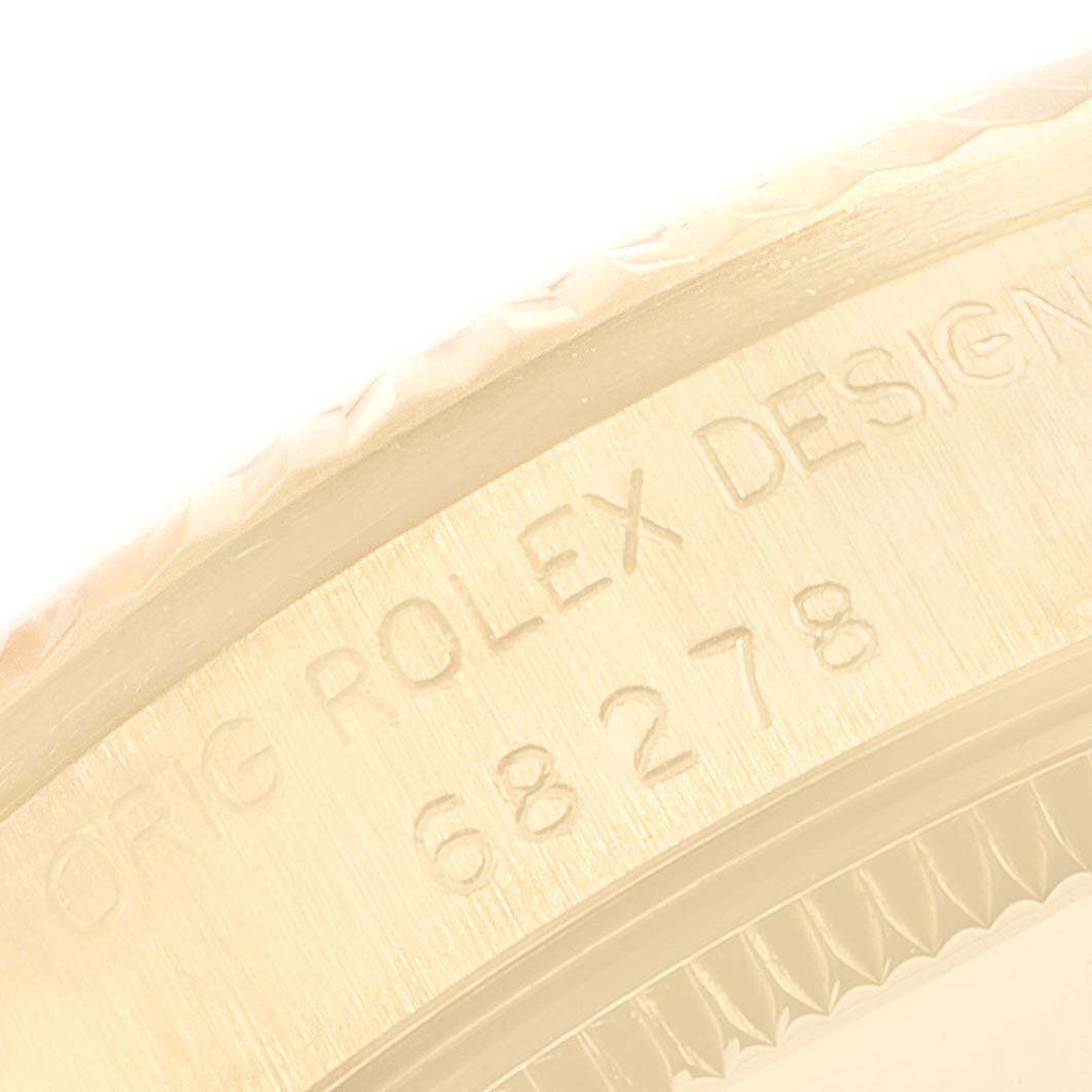 This image shows a close-up of the side engraving on a Rolex President 68278 Women's Yellow Gold Champagne Dial 68278 Women's Yellow Gold Champagne Dial watch.