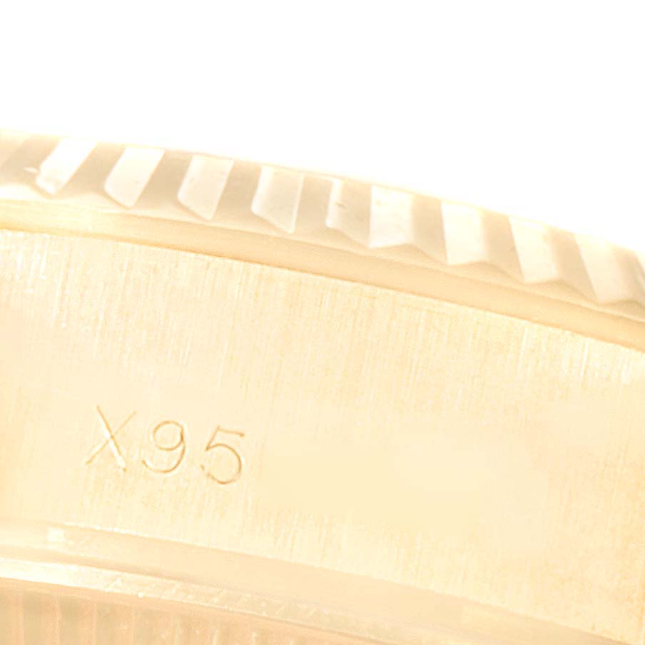 The image shows a close-up of the side engraving and part of the fluted bezel of the Rolex President 69178 Women
s Yellow Gold Champagne Dial 69178 Women
s Yellow Gold Champagne Dial model.
