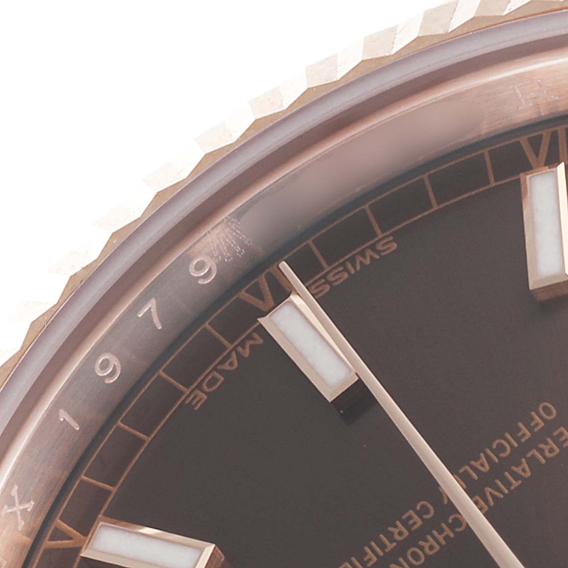 This close-up image shows part of the dial and bezel of the Rolex President 118135 Men's Rose Gold Brown Dial 118135 Men's Rose Gold Brown Dial model watch, featuring the hour markers and "Swiss Made" text.