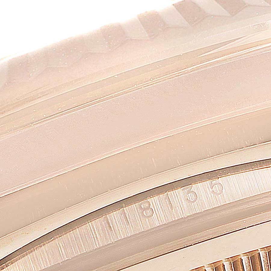 This image shows a close-up of the edge and bezel of a Rolex President 118135 Men's Rose Gold Brown Dial 118135 Men's Rose Gold Brown Dial model watch.
