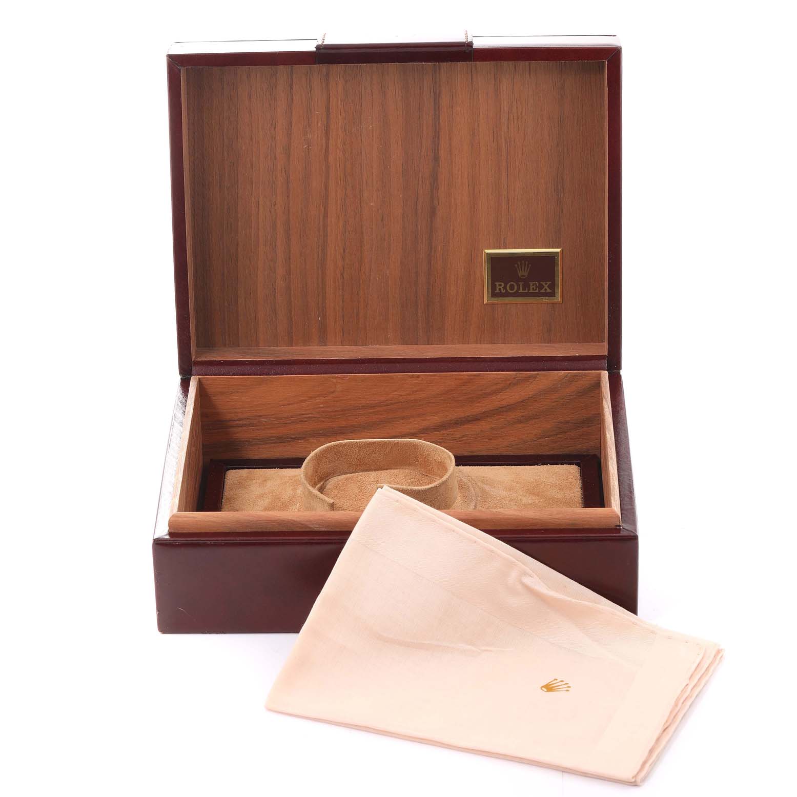 The image shows an open wooden Rolex box for the President model, with a cloth bearing the Rolex logo in front.