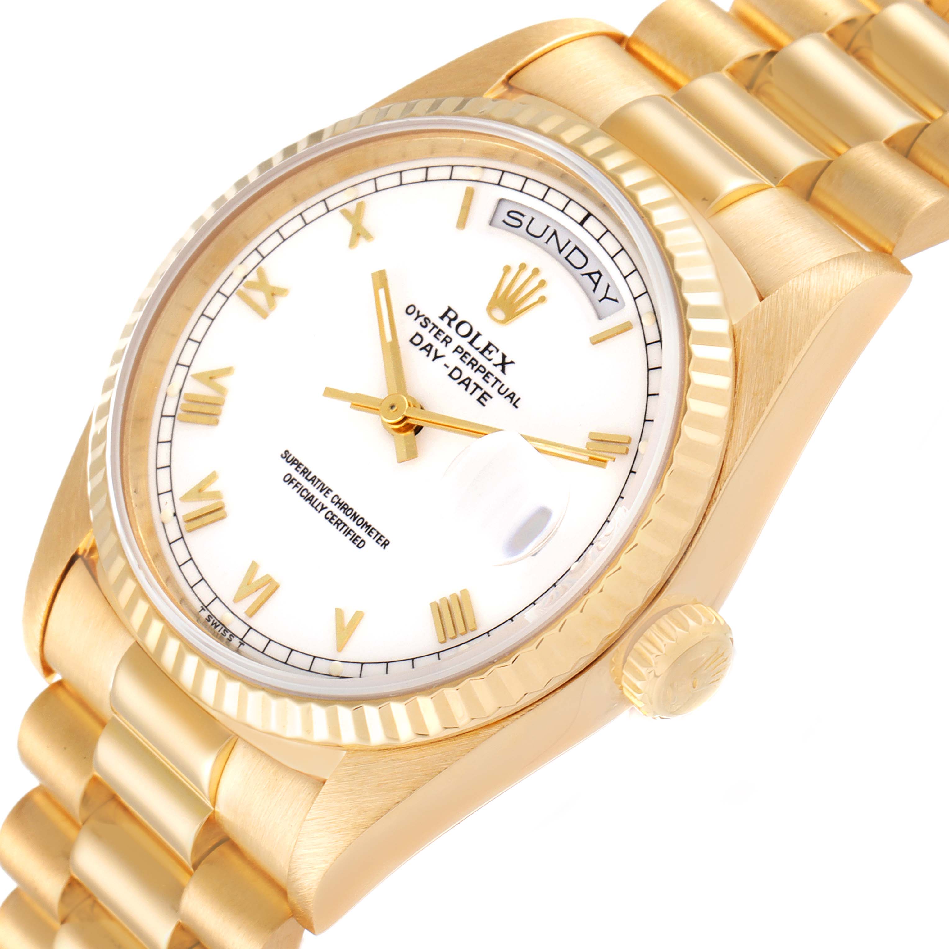 The image shows a close-up of a Rolex President 18238 Men
s Yellow Gold White Dial 18238 Men
s Yellow Gold White Dial model watch, highlighting the dial, bezel, crown, and part of the bracelet at an oblique angle.