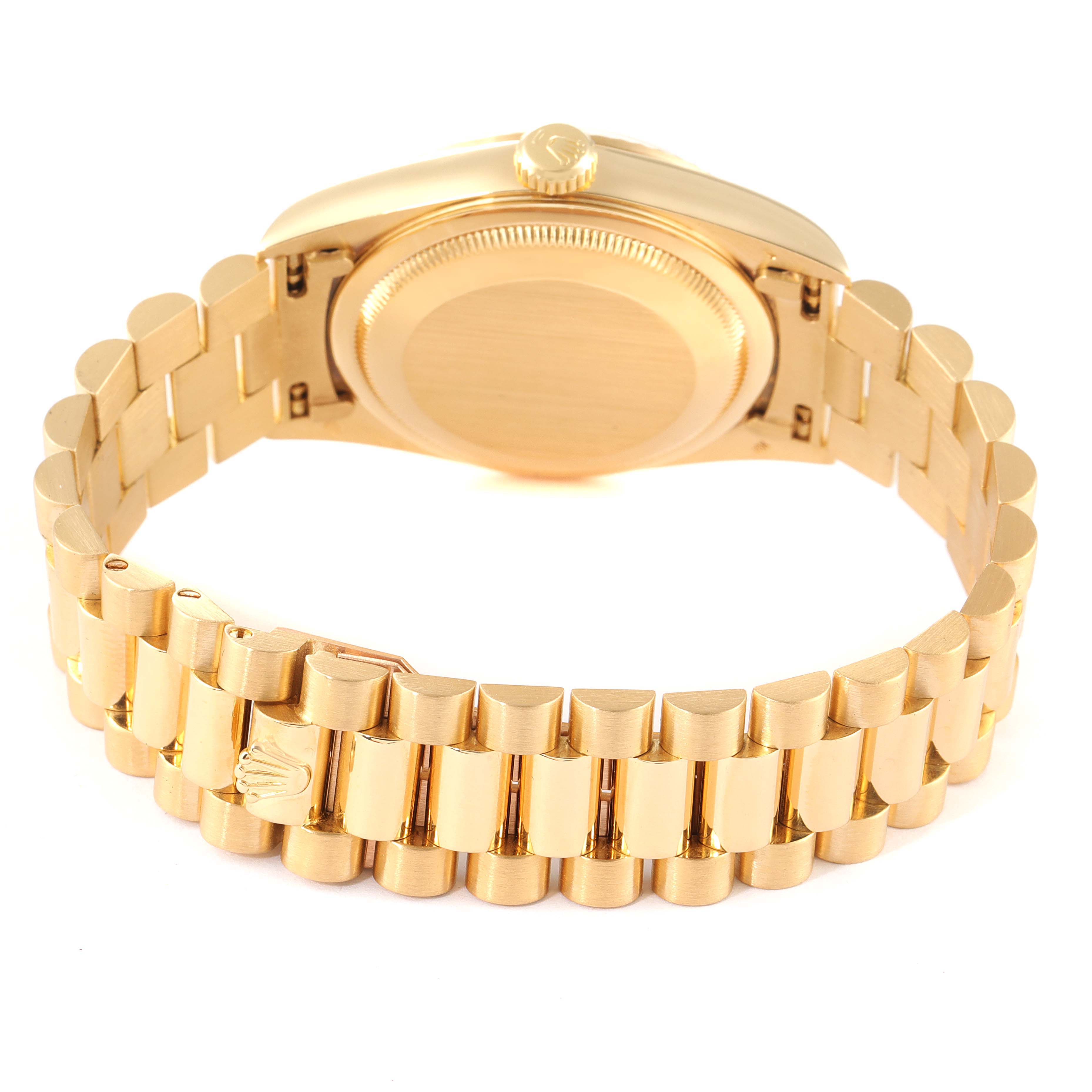 This image shows the backside of a Rolex President 18238 Men
s Yellow Gold White Dial 18238 Men
s Yellow Gold White Dial model watch along with its bracelet and clasp.