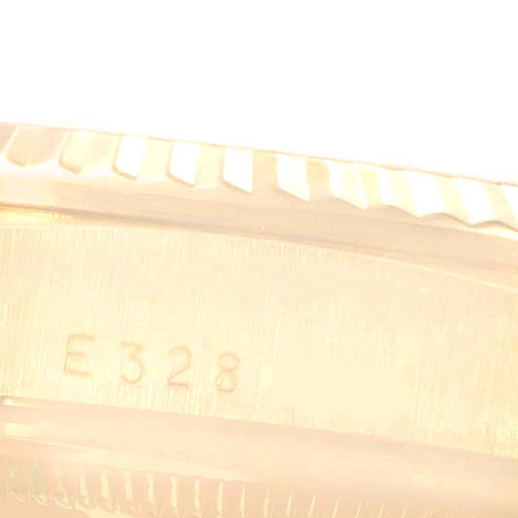 This close-up image shows the serial number on the side of the casing of a Rolex President 18238 Men
s Yellow Gold White Dial 18238 Men
s Yellow Gold White Dial model watch.