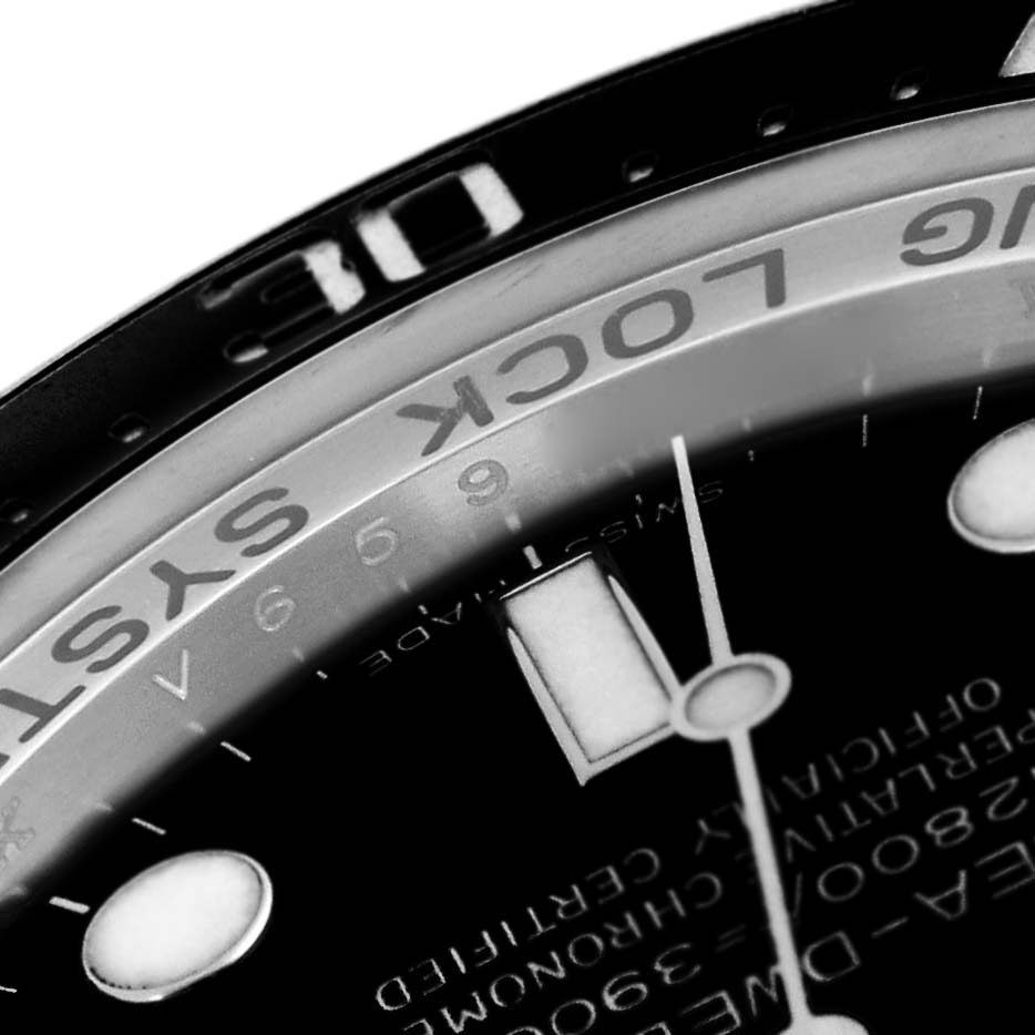 This close-up of the Rolex Sea-Dweller 116660 Men
s Stainless Steel Black Dial 116660 Men
s Stainless Steel Black Dial watch shows part of the dial, bezel, and hour markers.