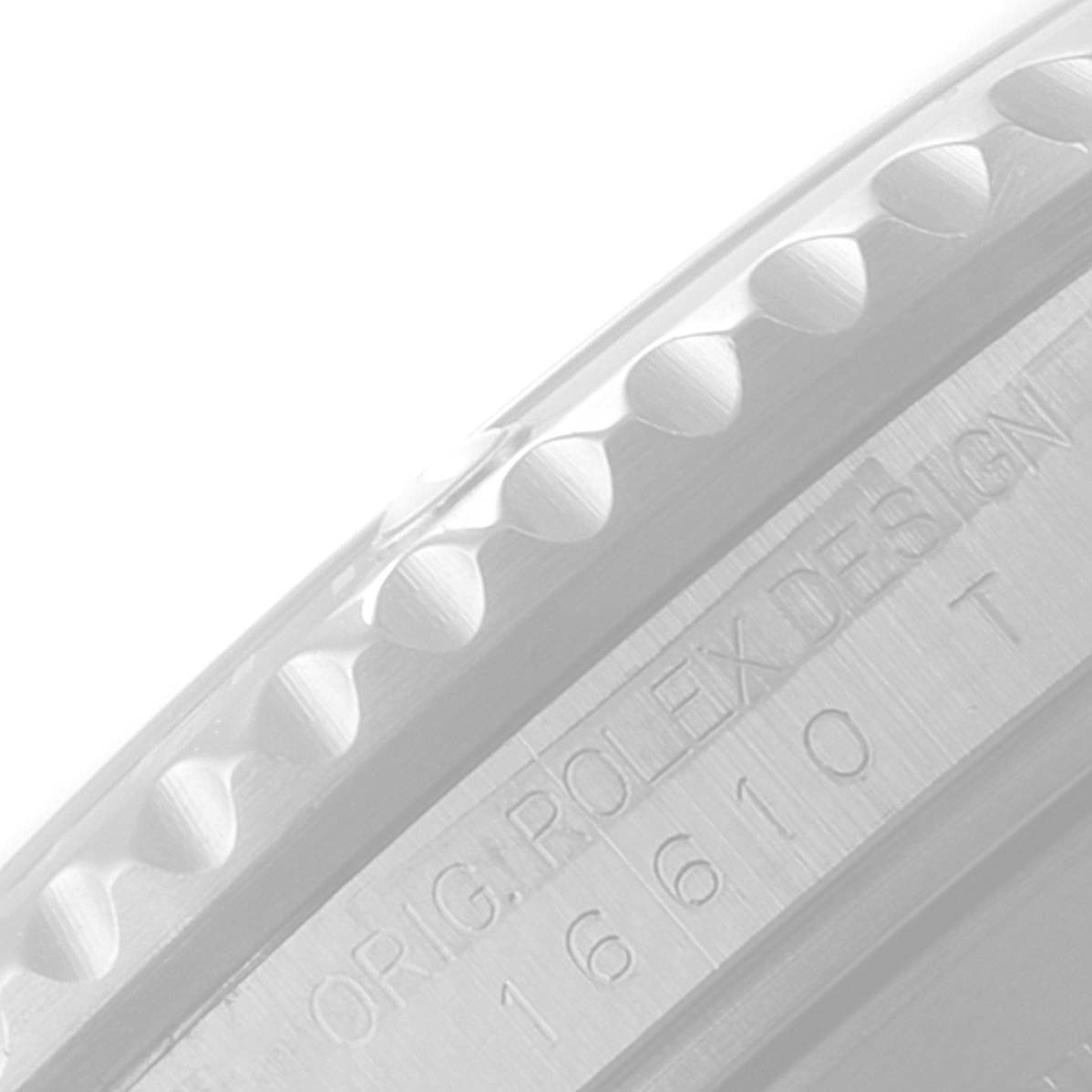 This image shows a close-up of the side of the bezel and engraved caseback of a Rolex Submariner 16610LV Men's Stainless Steel Black Dial 16610LV Men's Stainless Steel Black Dial model.