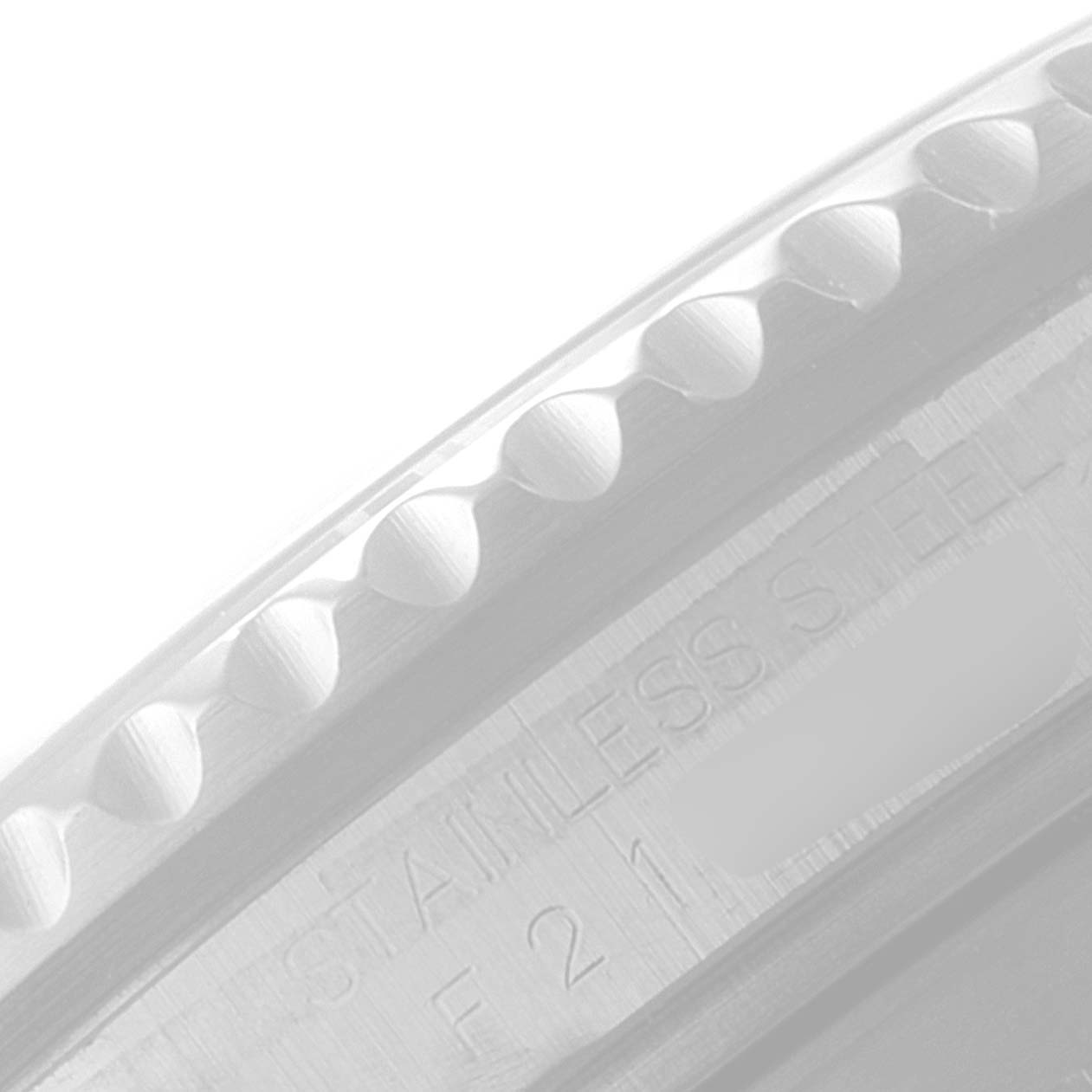 This image shows a close-up of the stainless steel bezel and part of the engravings on a Rolex Submariner 16610LV Men's Stainless Steel Black Dial 16610LV Men's Stainless Steel Black Dial watch.