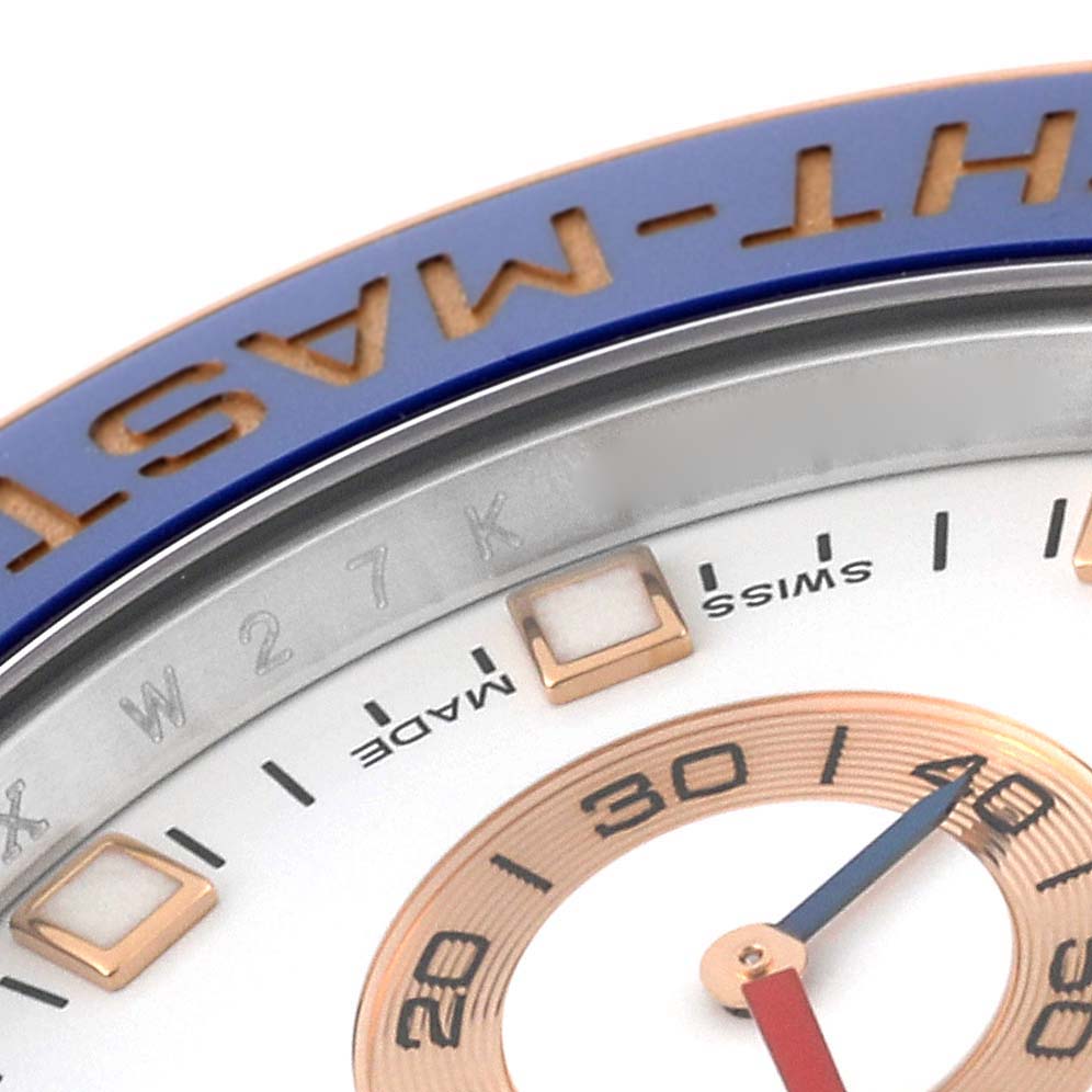 This close-up image of the Rolex Yacht-Master 116681 Men's Steel and Gold (two tone) White Dial 116681 Men's Steel and Gold (two tone) White Dial shows part of the dial, bezel, and minute markers.