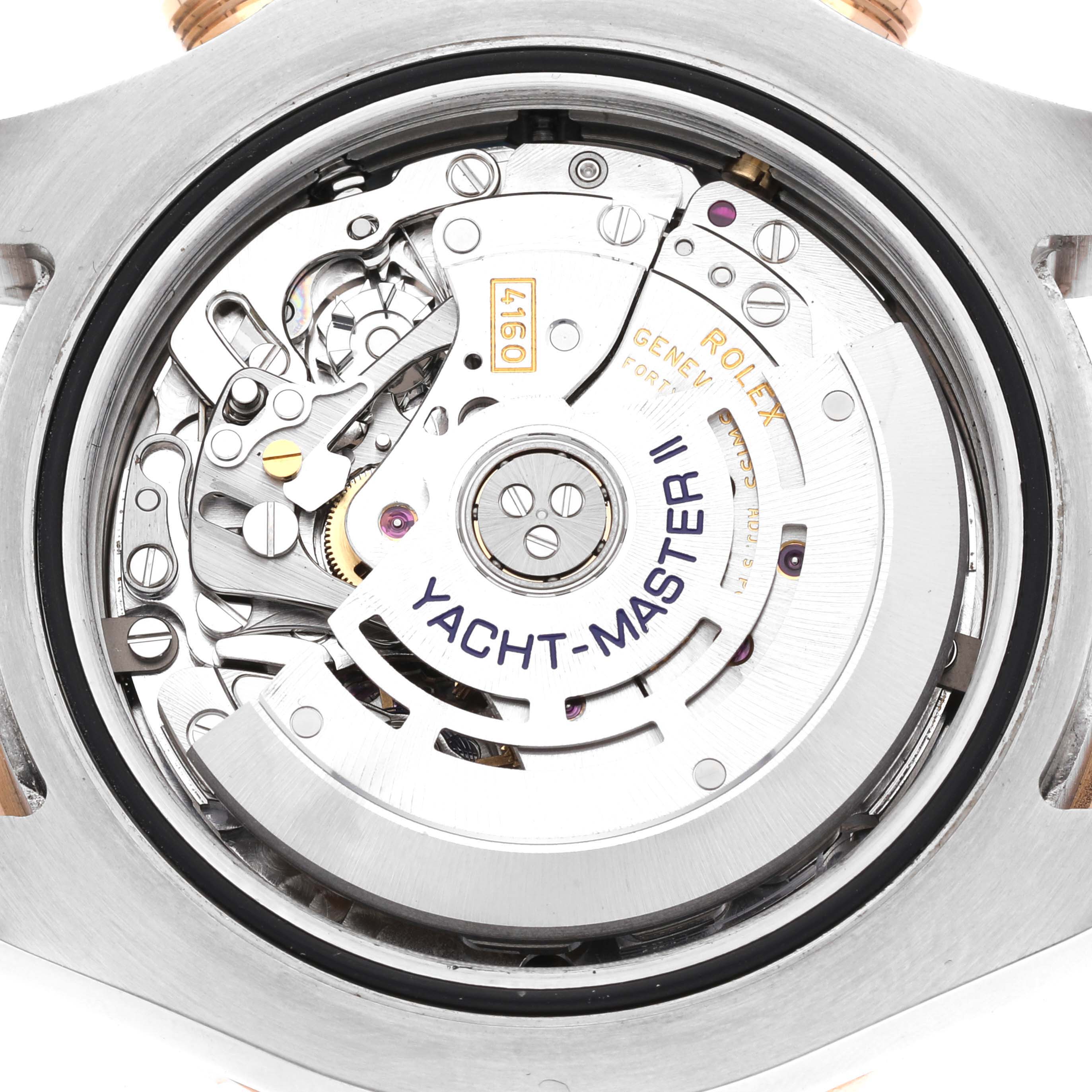 The image shows the inside mechanism of a Rolex Yacht-Master 116681 Men's Steel and Gold (two tone) White Dial 116681 Men's Steel and Gold (two tone) White Dial watch from a rear angle.