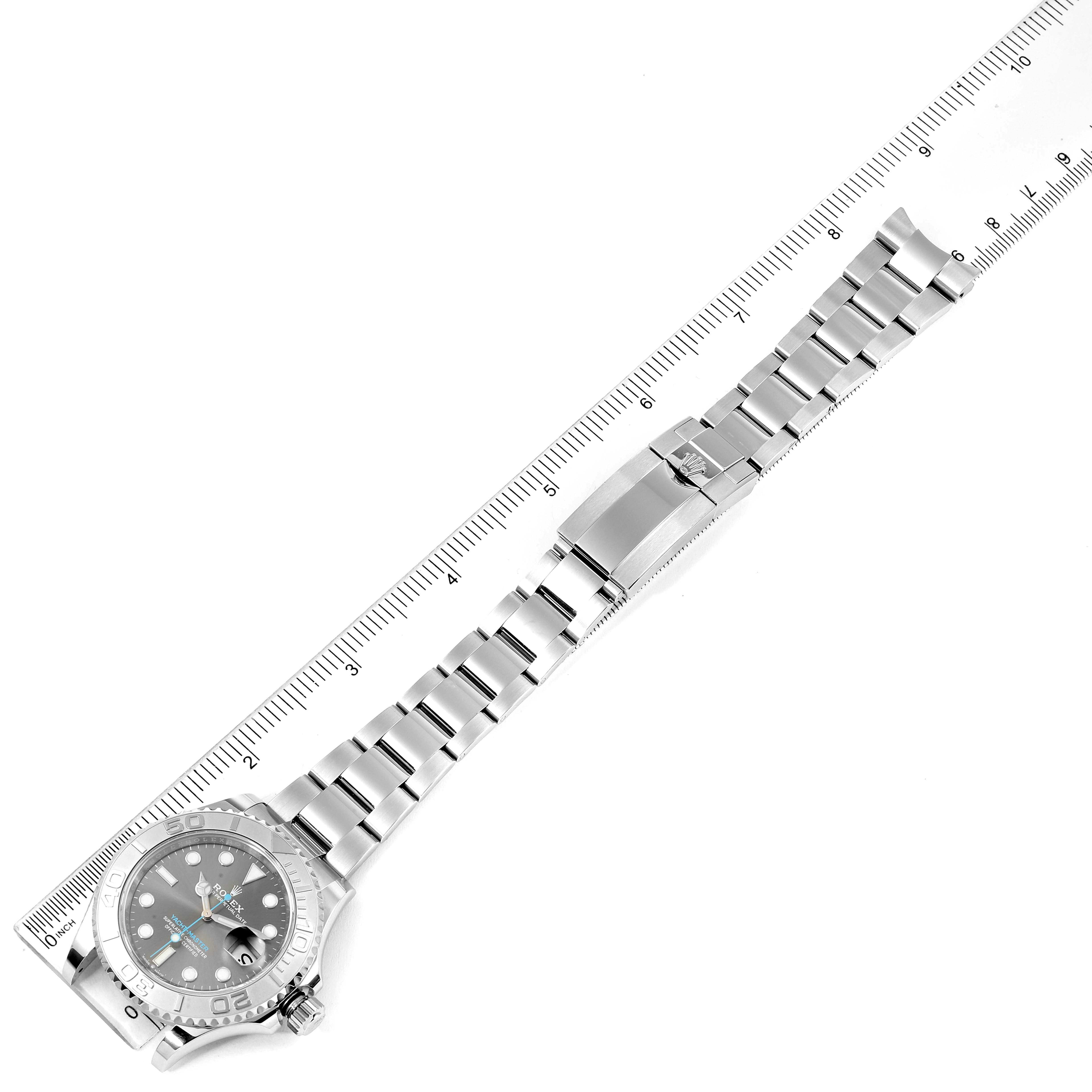 The image shows a full-length, top-down view of a Rolex Yacht-Master 116622 Men's Stainless Steel Grey Dial 116622 Men's Stainless Steel Grey Dial watch laid alongside a ruler.