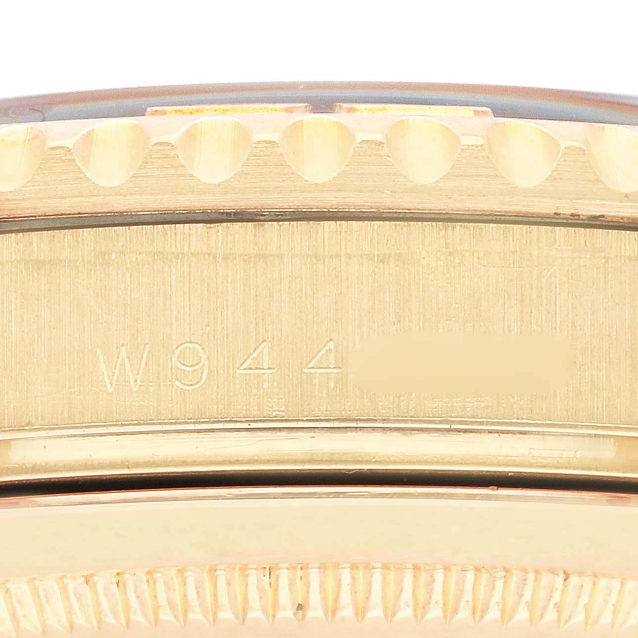 The image shows a close-up angle of the side of a Rolex Yacht-Master 16628NGS Men's Yellow Gold Mother of Pearl Dial 16628NGS Men's Yellow Gold Mother of Pearl Dial watch, highlighting the case with visible model engraving.