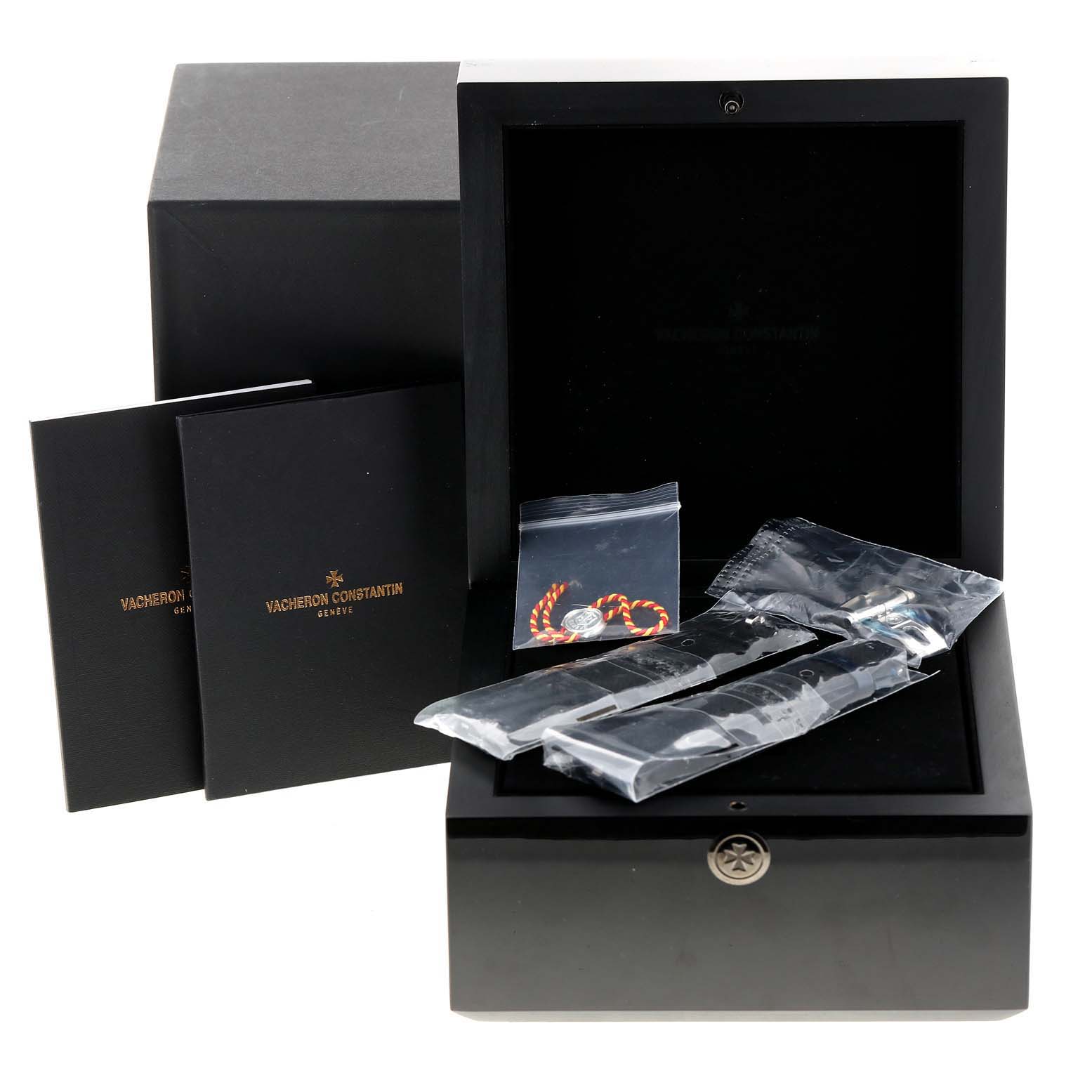 The image shows the Vacheron Constantin Overseas 4500V/110A-B483 Men's Stainless Steel Black Dial 4500V/110A-B483 Men's Stainless Steel Black Dial watch box and accessories, including straps and documentation.