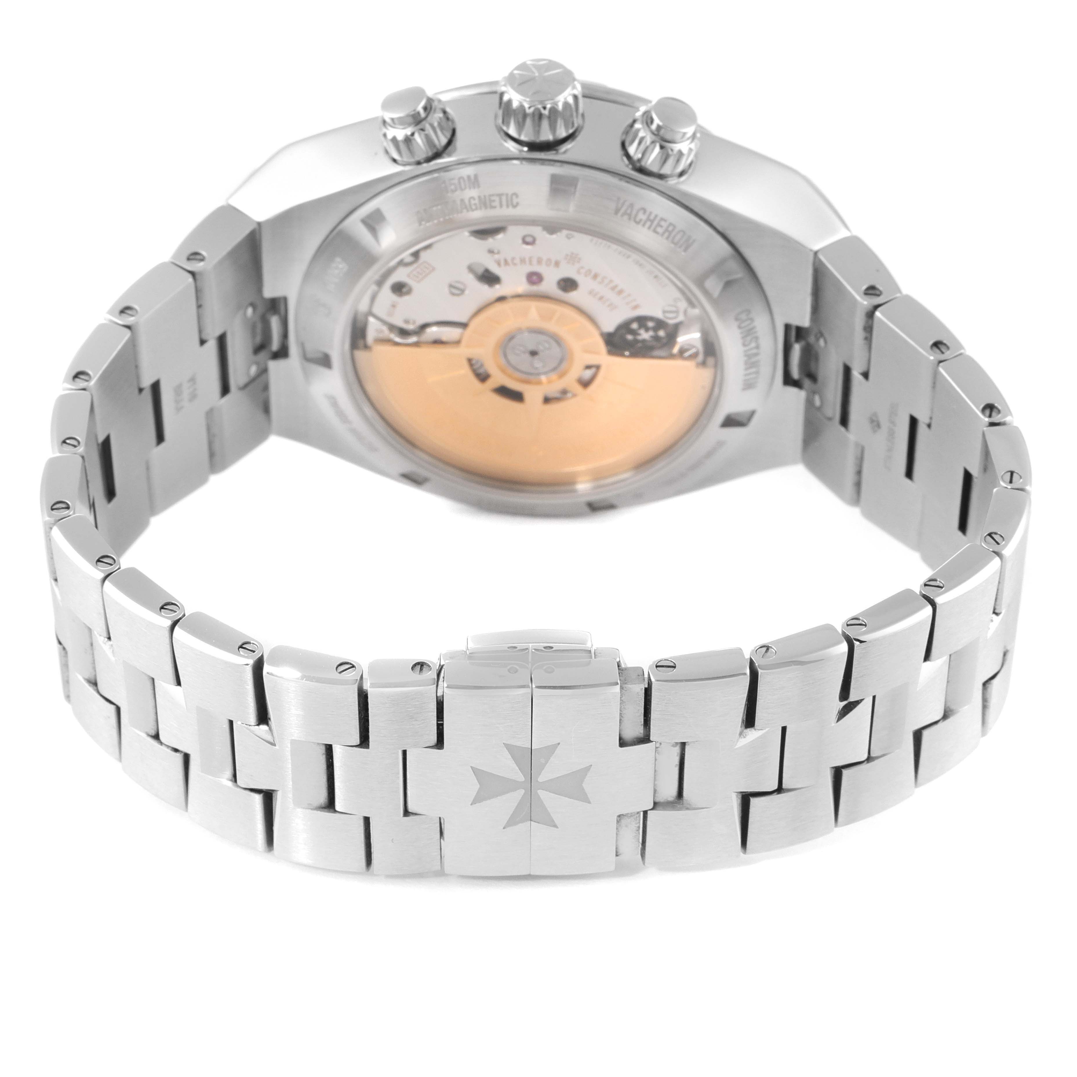 The image shows the back side of a Vacheron Constantin Overseas 5500V/110A-B148 Men's Stainless Steel Blue Dial 5500V/110A-B148 Men's Stainless Steel Blue Dial watch, highlighting its movement, case back, and metal bracelet.