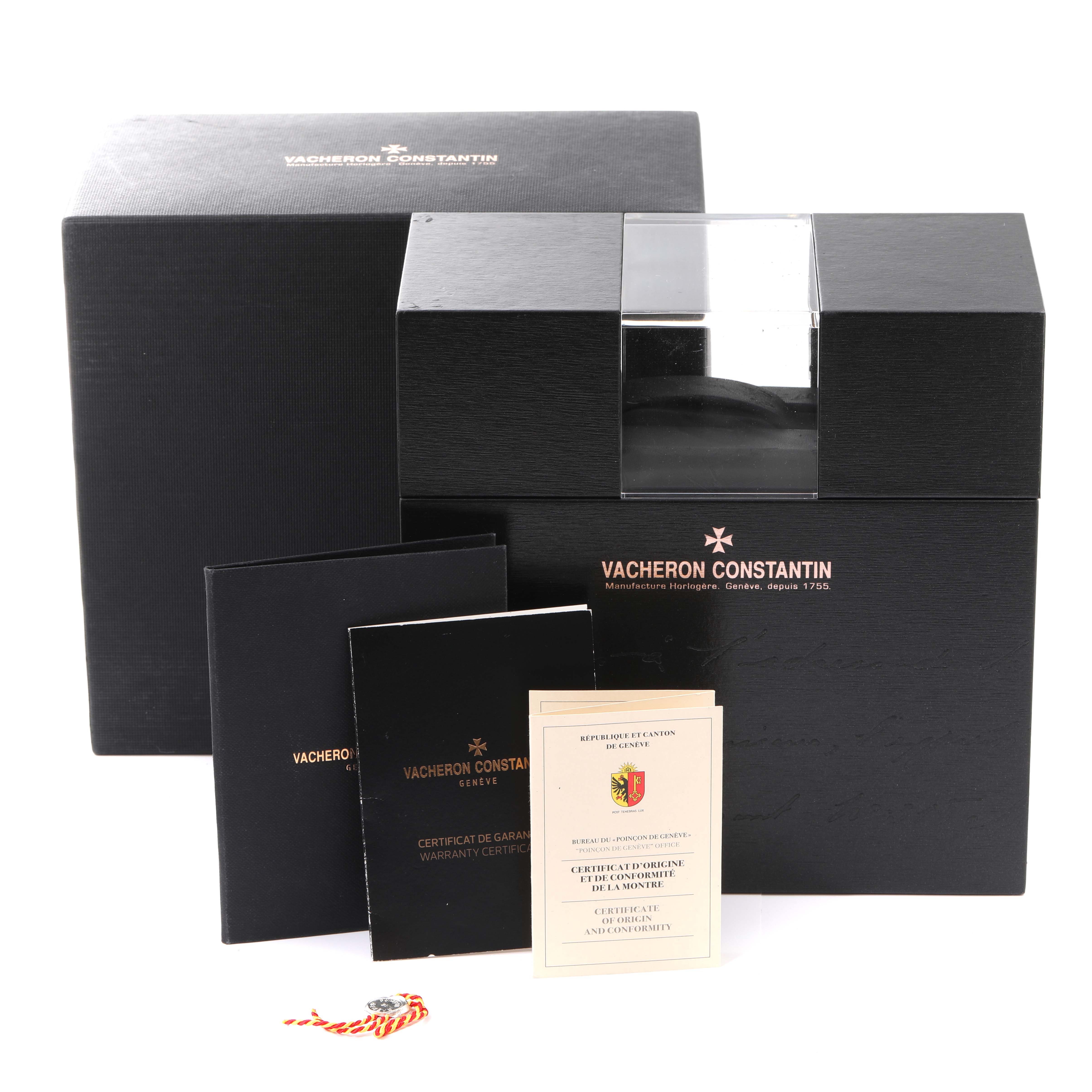 The image shows the Vacheron Constantin Overseas 4500V/110A-B128 Men's Stainless Steel Blue Dial 4500V/110A-B128 Men's Stainless Steel Blue Dial watch box set with warranty cards and certificates placed in front of the box.