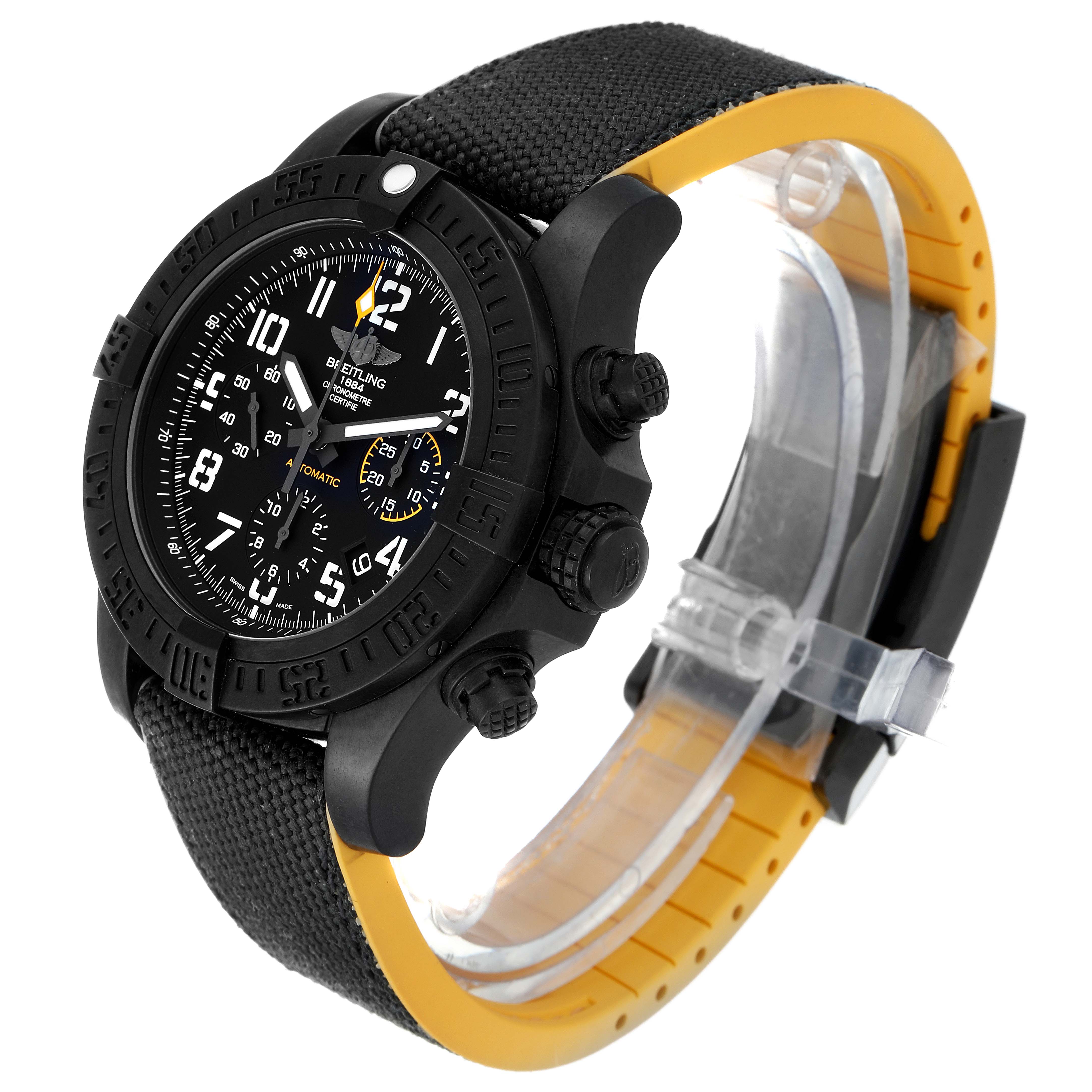 The image shows a Breitling Avenger XB0180E4/BF31 Men's Titanium Black Dial XB0180E4/BF31 Men's Titanium Black Dial watch at a three-quarter angle, highlighting its black dial, bezel, and fabric strap with a yellow underside.