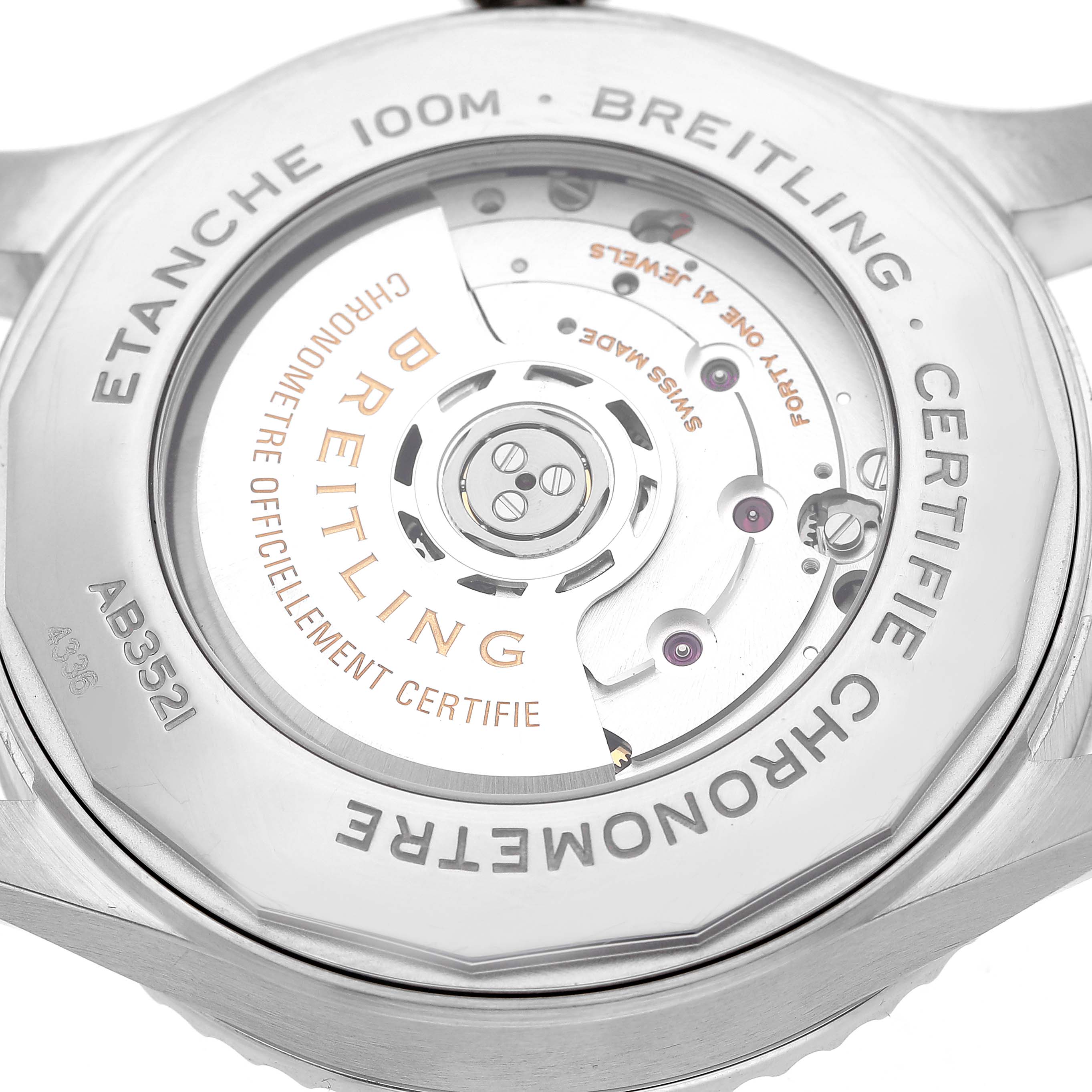 The image shows a detailed view of the Breitling Aviator AB3521U41B1A1 Men's Stainless Steel Blue Dial watch's back case, displaying its mechanical movement and engravings.