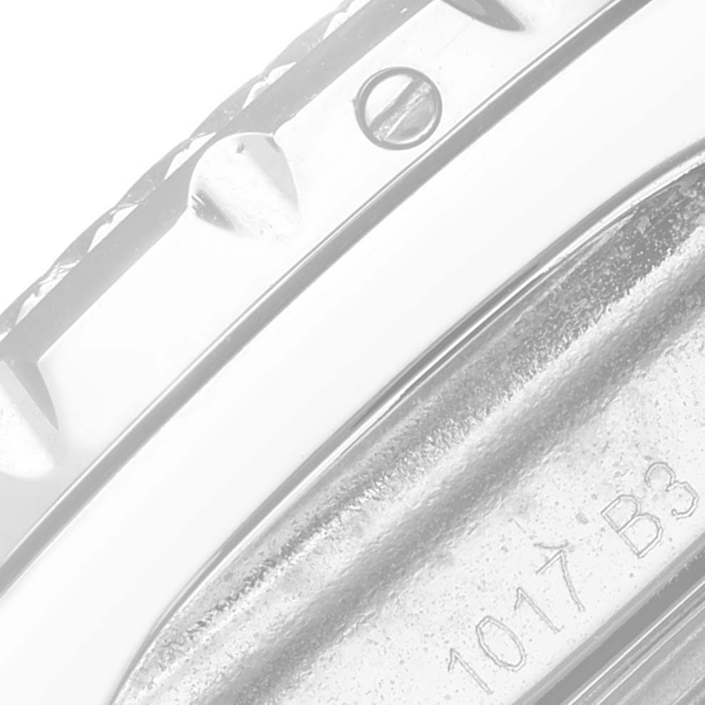 The image shows a close-up of the side of a Breitling Bentley A13362 Men's Stainless Steel Mother of Pearl Dial A13362 Men's Stainless Steel Mother of Pearl Dial watch, focusing on the bezel and a part of the engraved inner case.
