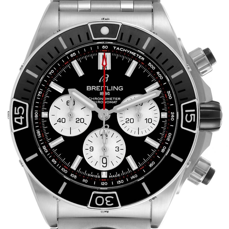 The Breitling Chronomat watch is shown from the front, highlighting the dial, tachymeter, and bezel.