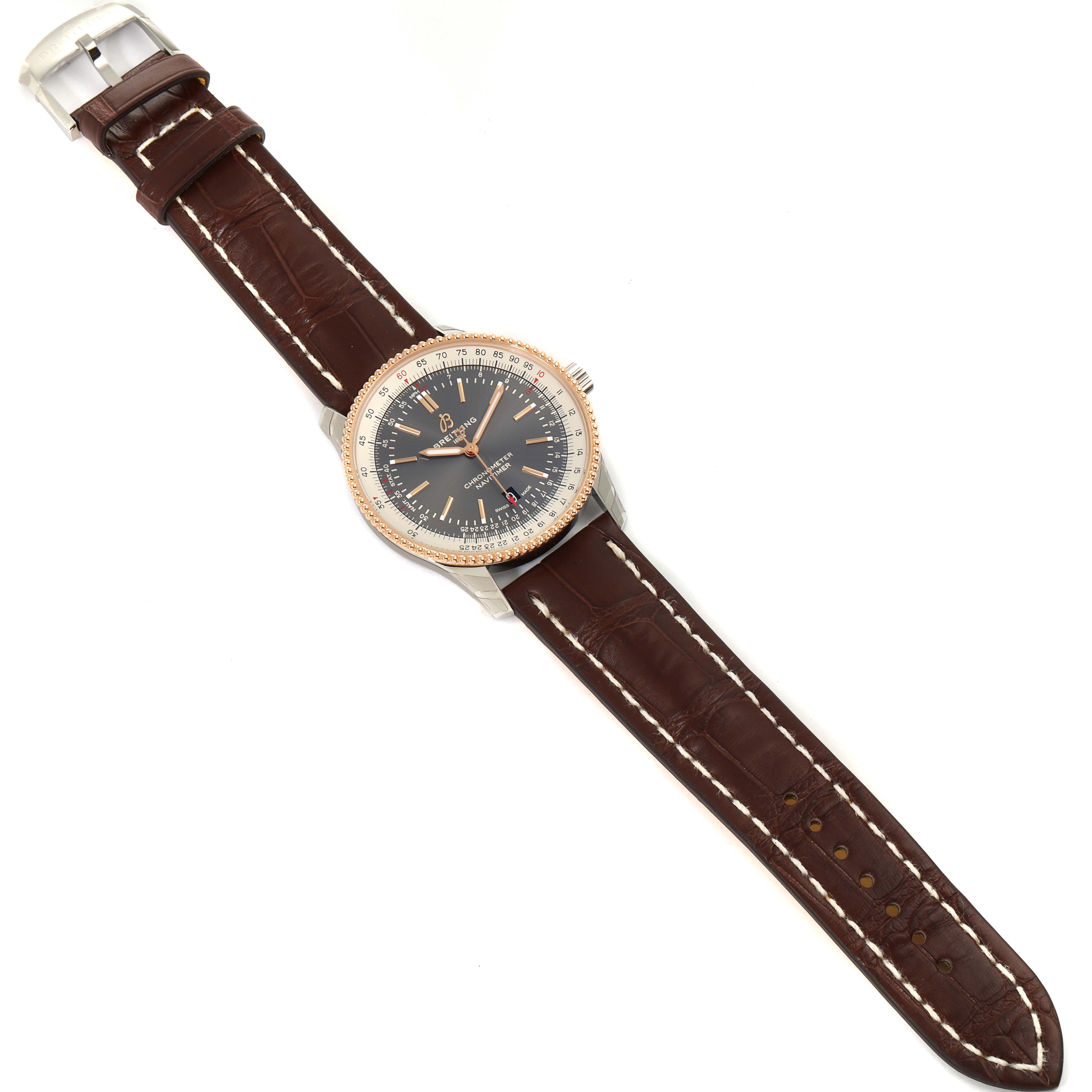 The image shows a top view of a Breitling Navitimer U17326211M1P1 Men's Stainless Steel Grey Dial U17326211M1P1 Men's Stainless Steel Grey Dial watch with a brown leather strap and a detailed dial.