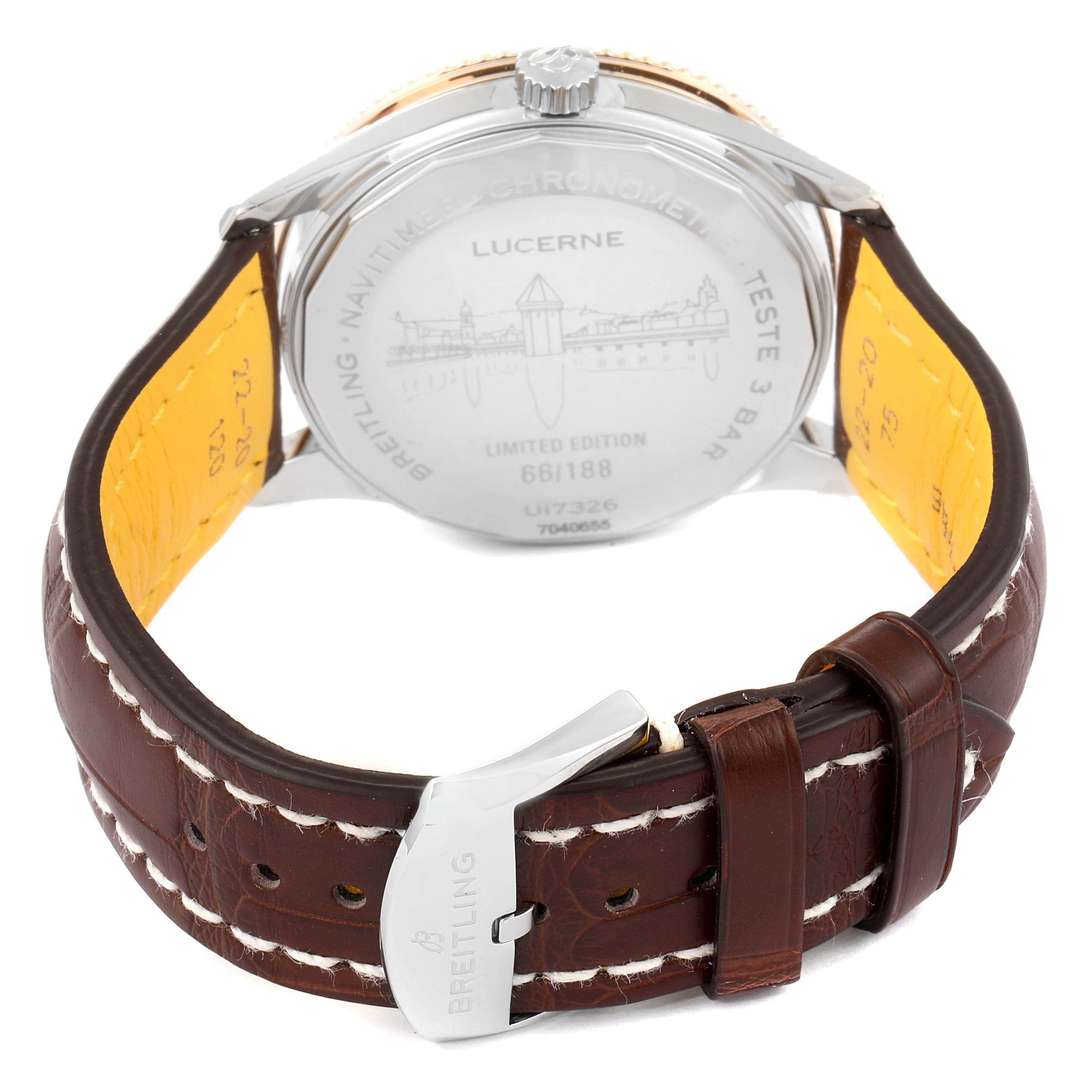 The image shows the back of the Breitling Navitimer U17326211M1P1 Men's Stainless Steel Grey Dial U17326211M1P1 Men's Stainless Steel Grey Dial watch and its leather strap with a buckle from a slightly elevated rear angle.