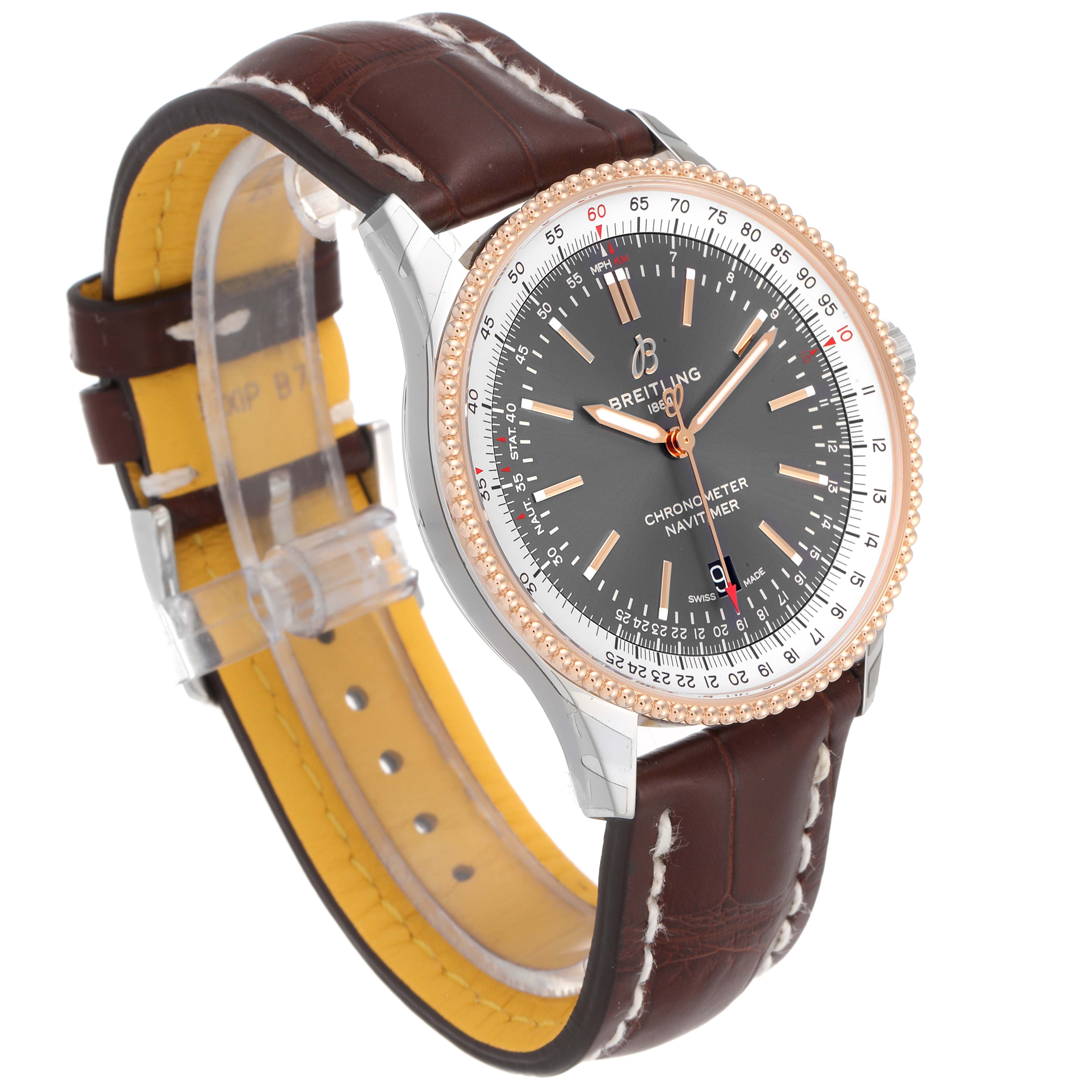 The Breitling Navitimer U17326211M1P1 Men's Stainless Steel Grey Dial U17326211M1P1 Men's Stainless Steel Grey Dial watch is shown at an angle, highlighting its brown leather strap, rose gold bezel, and detailed black dial.