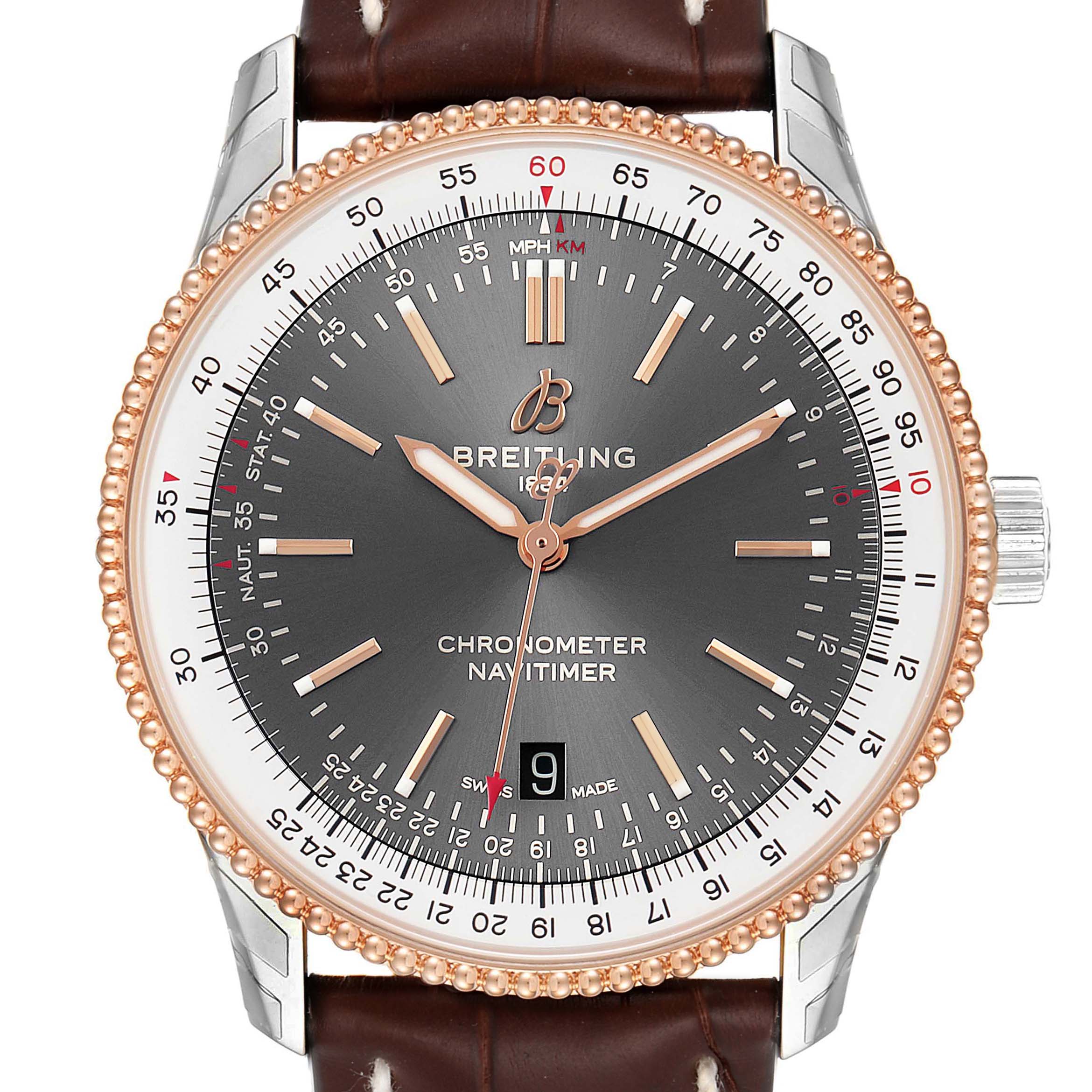 The image shows a Breitling Navitimer U17326211M1P1 Men's Stainless Steel Grey Dial U17326211M1P1 Men's Stainless Steel Grey Dial watch face with a brown leather strap, rose gold bezel, and visible chronograph details from a front angle.