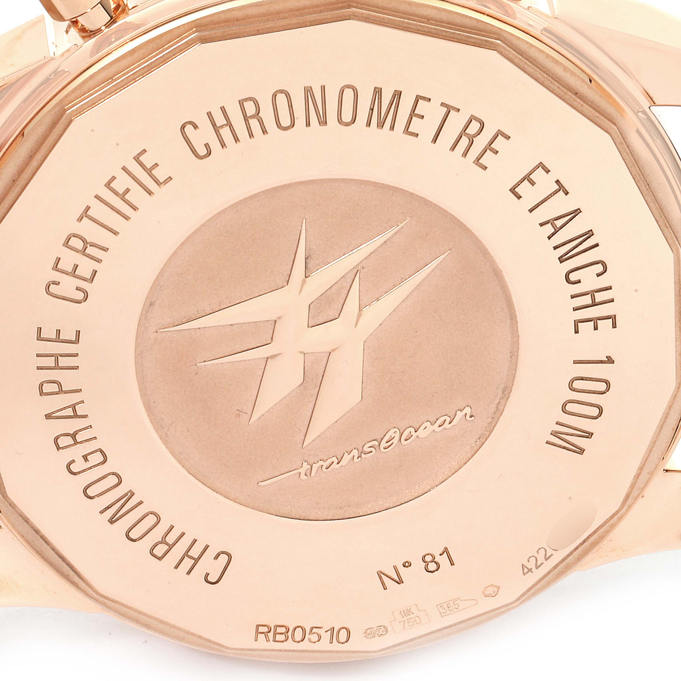 This close-up image shows the case back of a Breitling Transocean RB0510U4-BB63BKLD Men's Rose Gold White Dial RB0510U4-BB63BKLD Men's Rose Gold White Dial watch, highlighting its engravings and markings.
