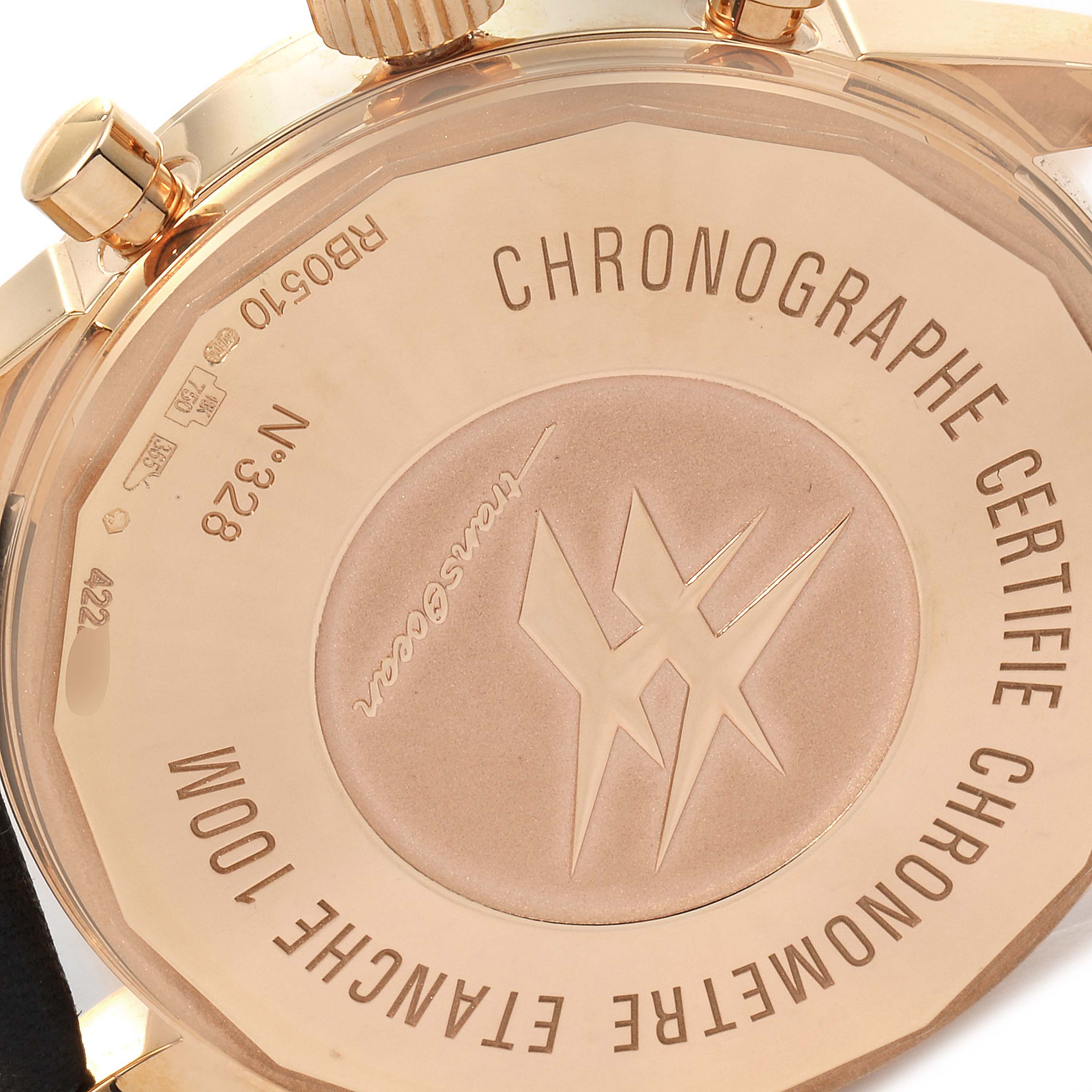 The image shows the back case of the Breitling Transocean RB0510U4-BB63BKLD Men's Rose Gold Black Dial RB0510U4-BB63BKLD Men's Rose Gold Black Dial watch, highlighting the engraved markings and the crown.