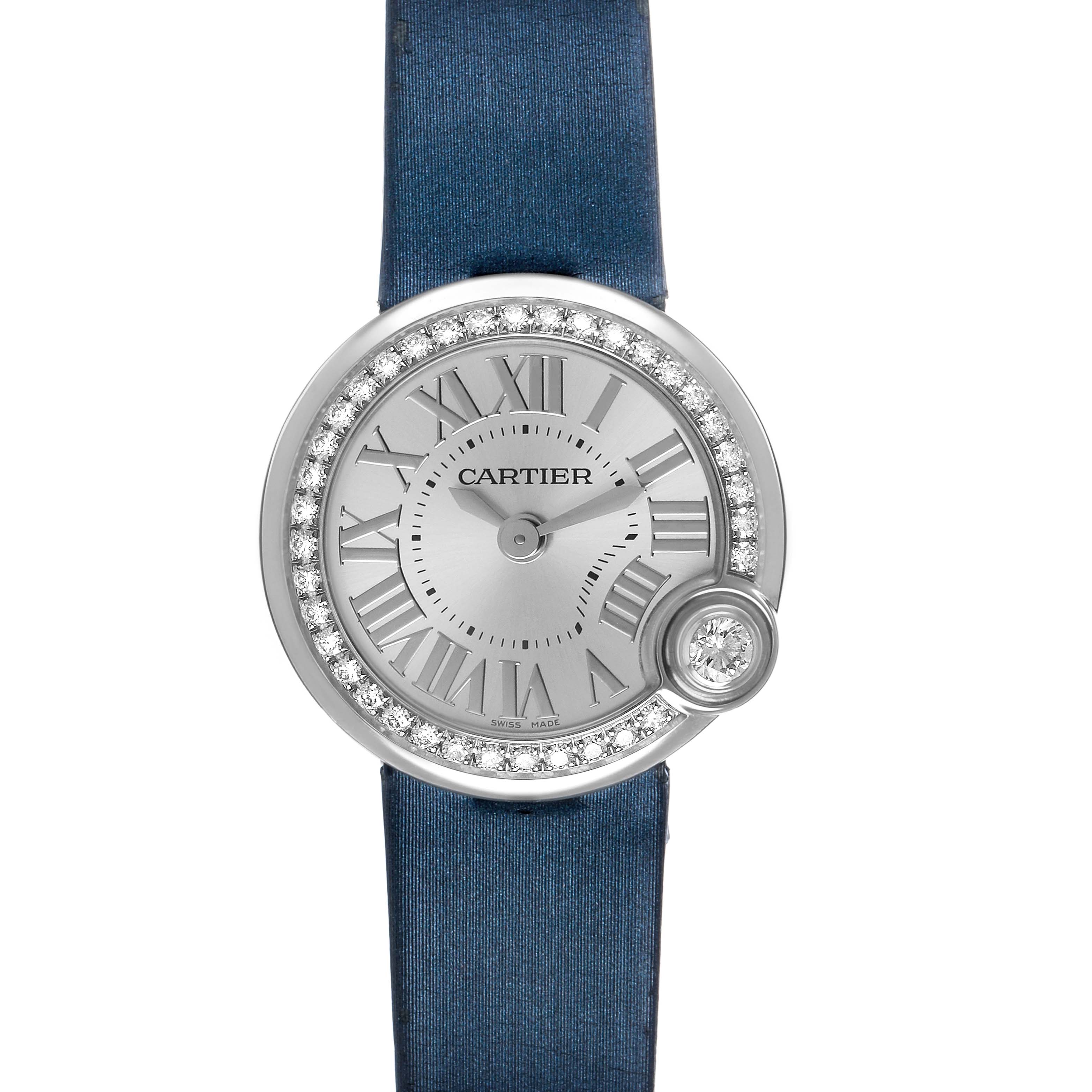 The Cartier Ballon Blanc W4BL0002 Women's Stainless Steel Silver Dial watch is shown from a top view, highlighting its round face, diamond bezel, and blue strap.