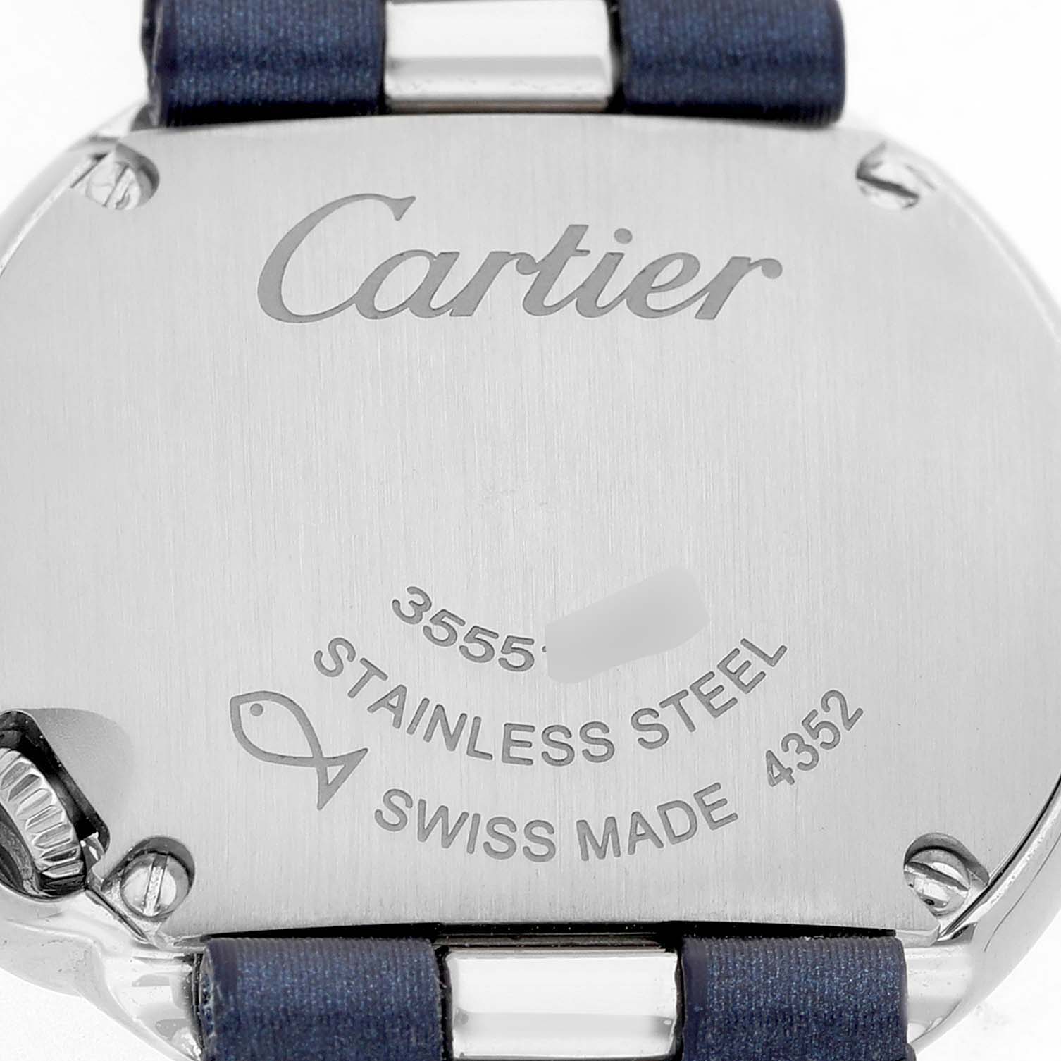 The image shows the back of the Cartier Ballon Blanc W4BL0002 Women's Stainless Steel Silver Dial watch, displaying engraving details and part of the blue strap.