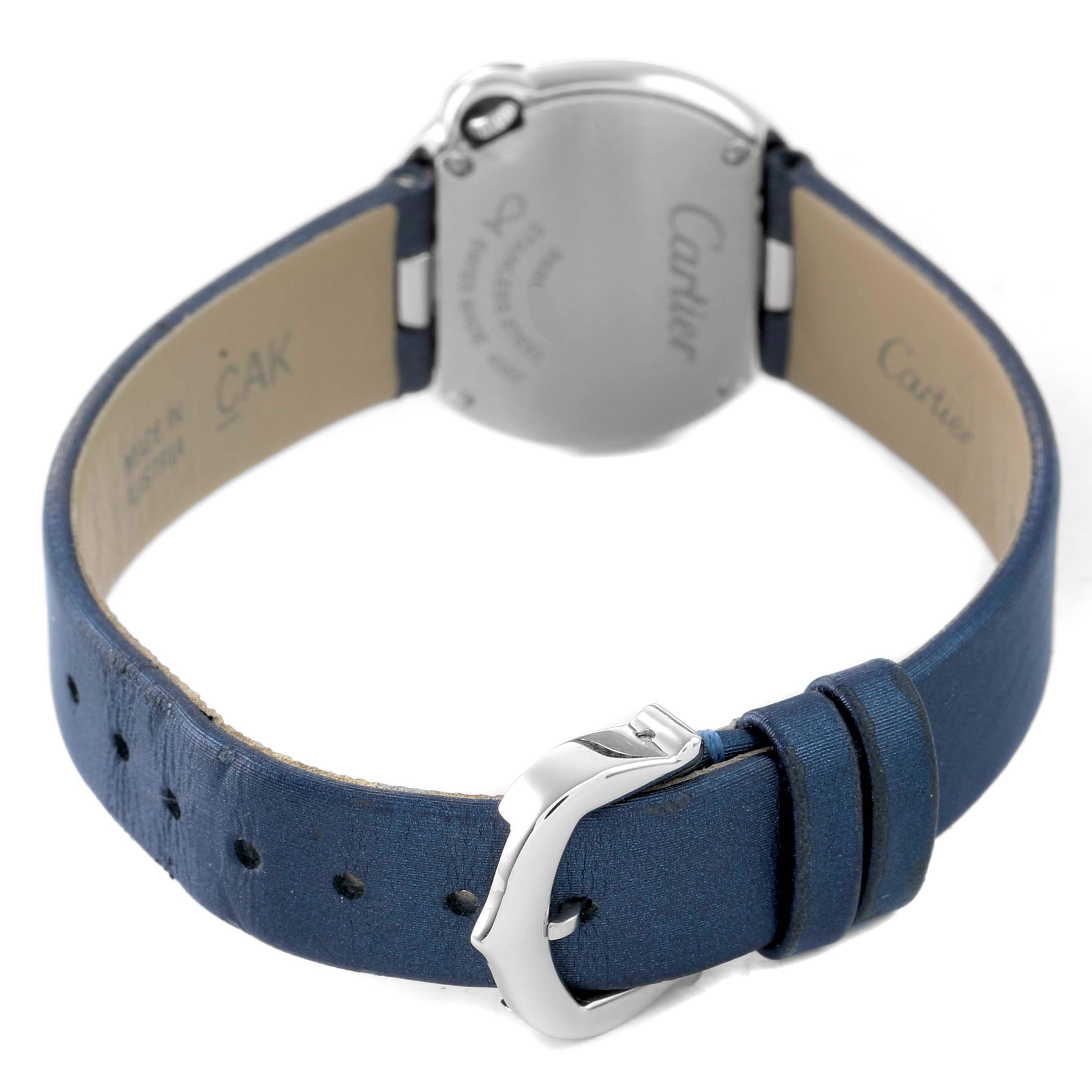 The image shows the back view of the Cartier Ballon Blanc W4BL0002 Women's Stainless Steel Silver Dial watch, highlighting the case back and blue leather strap with a buckle.