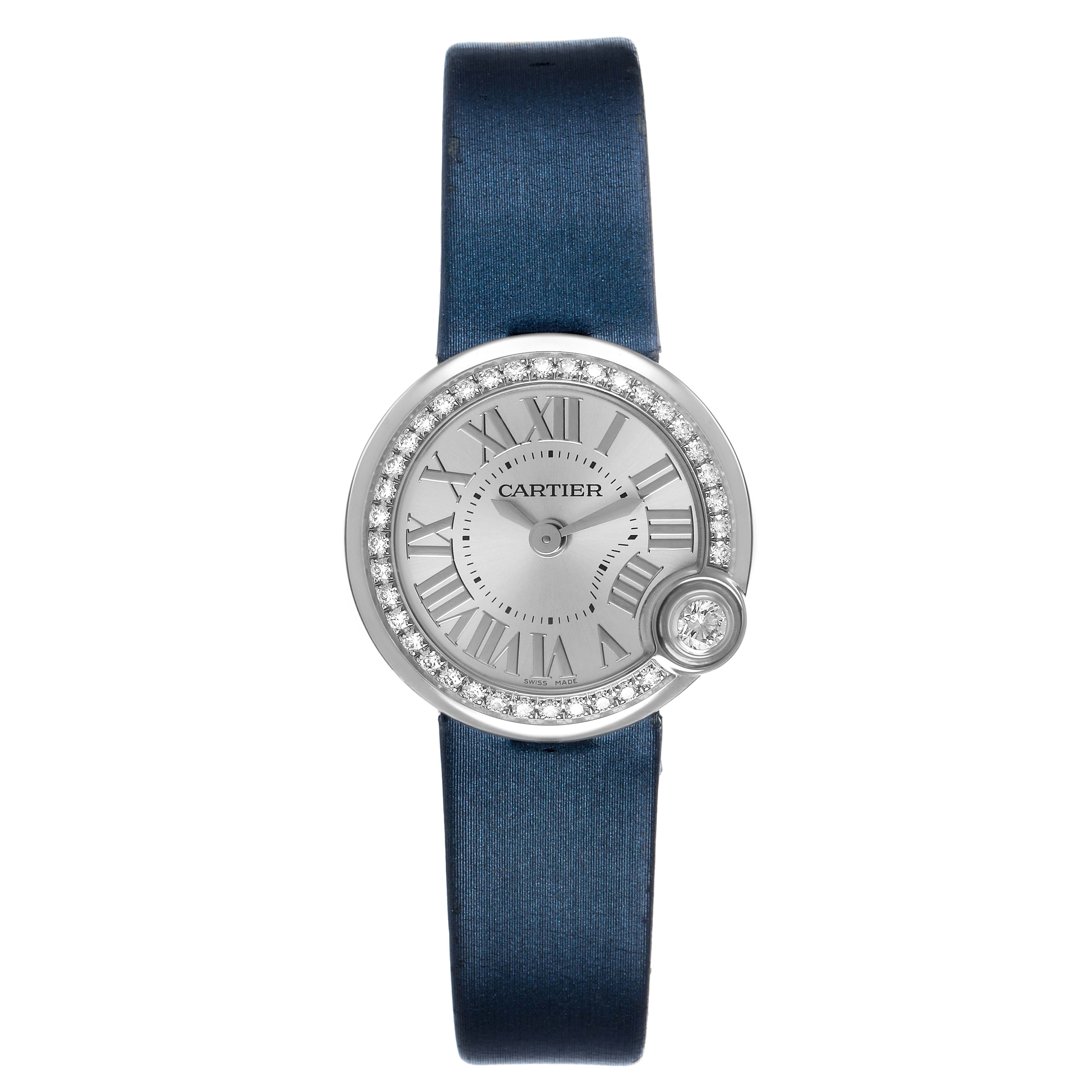 The Cartier Ballon Blanc W4BL0002 Women's Stainless Steel Silver Dial watch is shown from the front, highlighting its round face, diamond bezel, and blue strap.