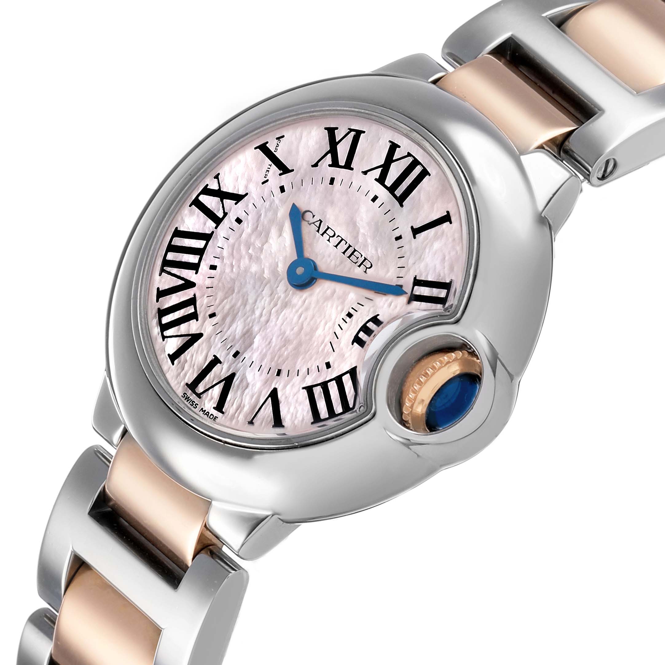 The Cartier Ballon Bleu W6920034 Women's Stainless Steel Mother of Pearl Dial watch is shown at an angled view highlighting the dial, Roman numerals, and crown with a sapphire cabochon.