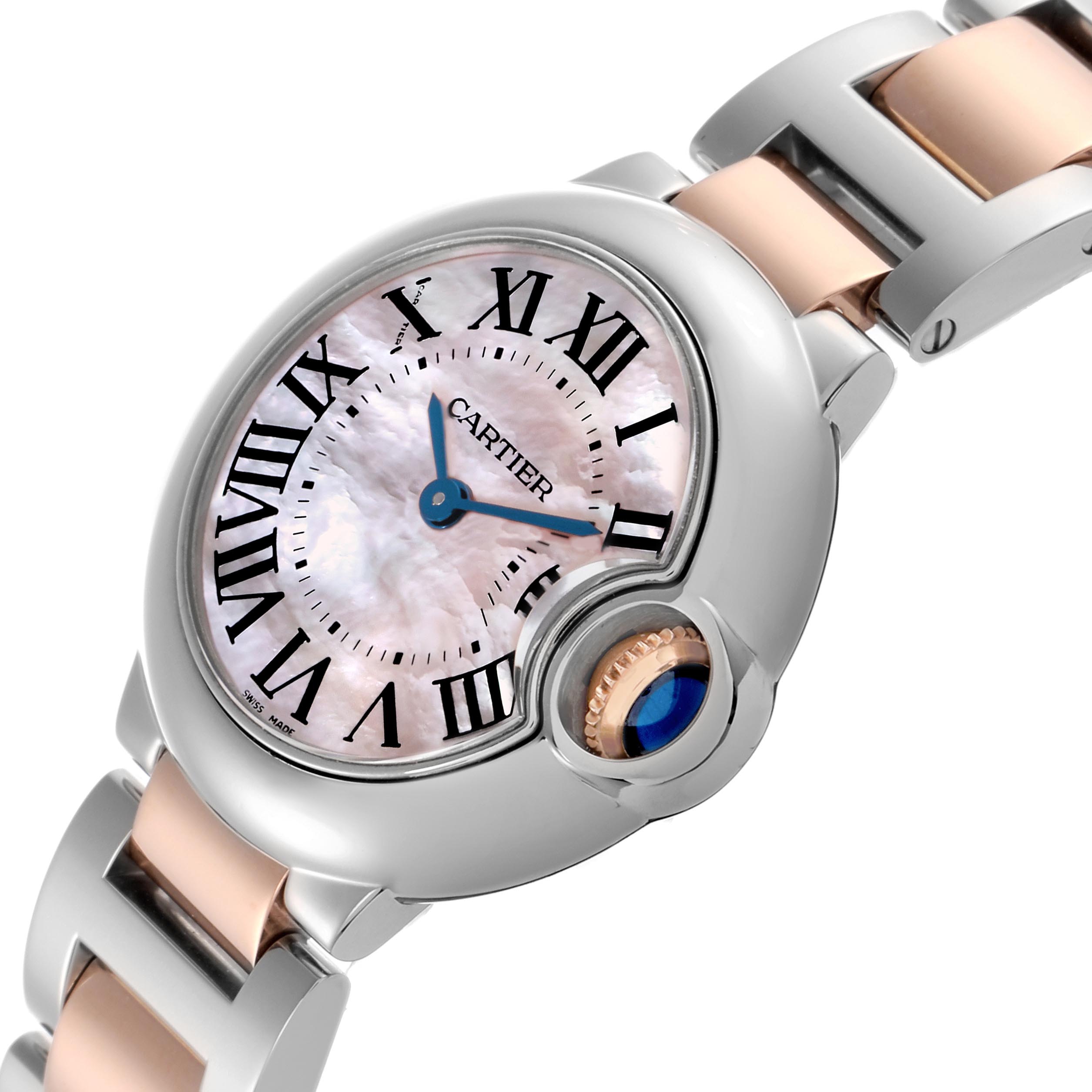 The Cartier Ballon Bleu W6920034 Women's Steel and Gold (two tone) Mother of Pearl Dial W6920034 Women's Steel and Gold (two tone) Mother of Pearl Dial watch is shown from a three-quarter angle, highlighting the face, crown, and part of the bracelet.