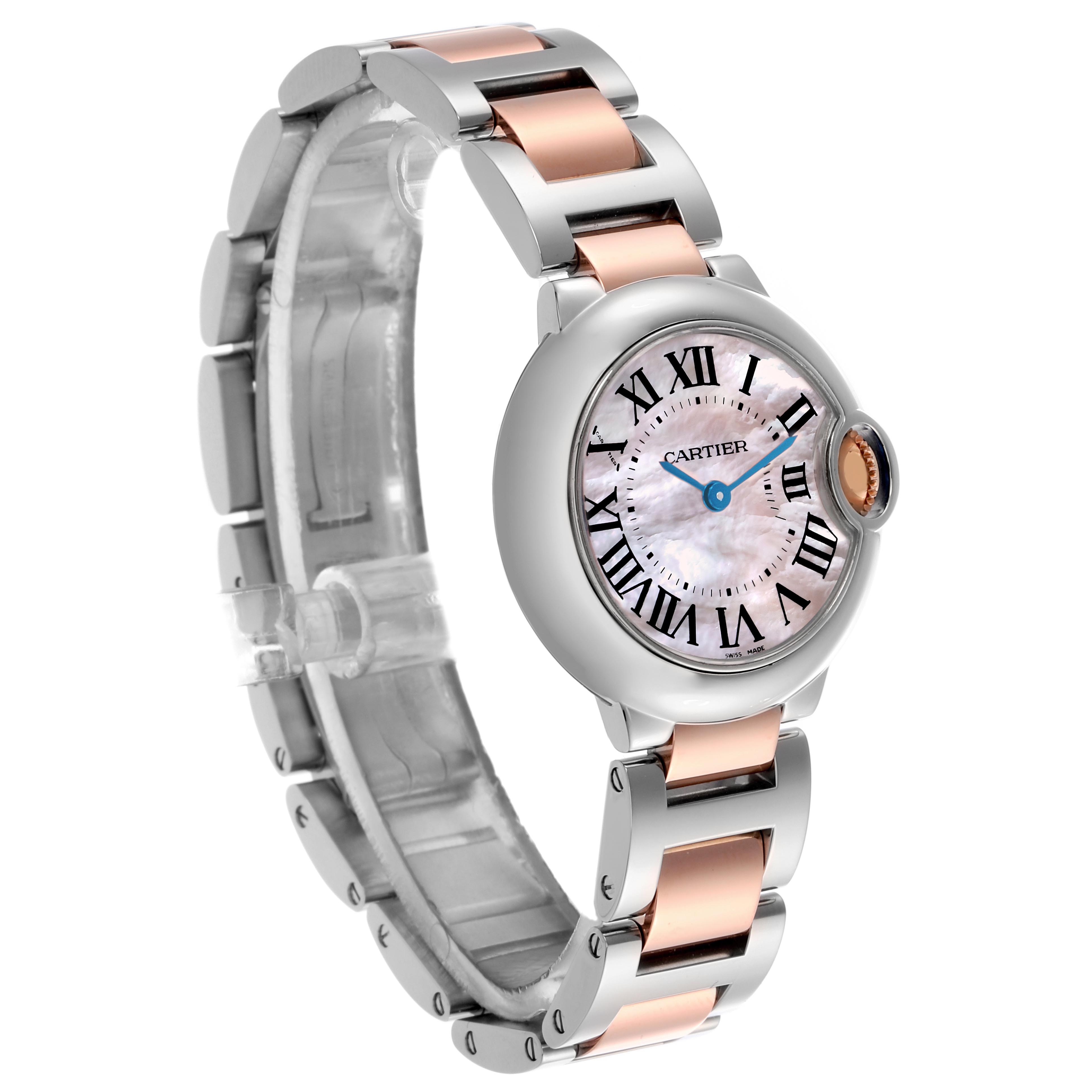 The Cartier Ballon Bleu W6920034 Women's Steel and Gold (two tone) Mother of Pearl Dial W6920034 Women's Steel and Gold (two tone) Mother of Pearl Dial watch is shown at a three-quarter angle, highlighting its metal bracelet and round dial with Roman numerals.