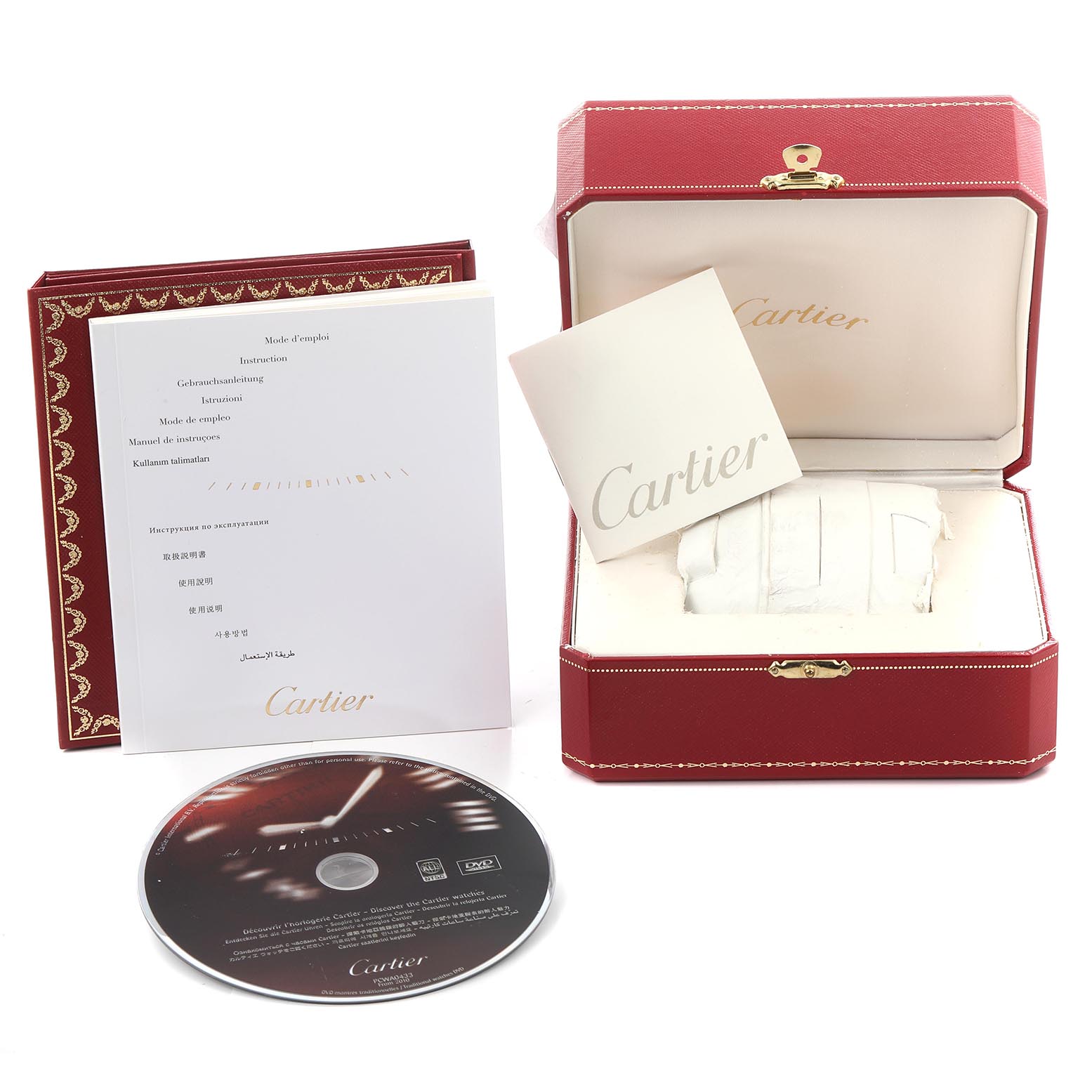 The image shows the packaging and accessories of a Cartier Pasha W31089M7 Men's Stainless Steel Silver Dial W31089M7 Men's Stainless Steel Silver Dial watch, including the red box, manuals, and a DVD.