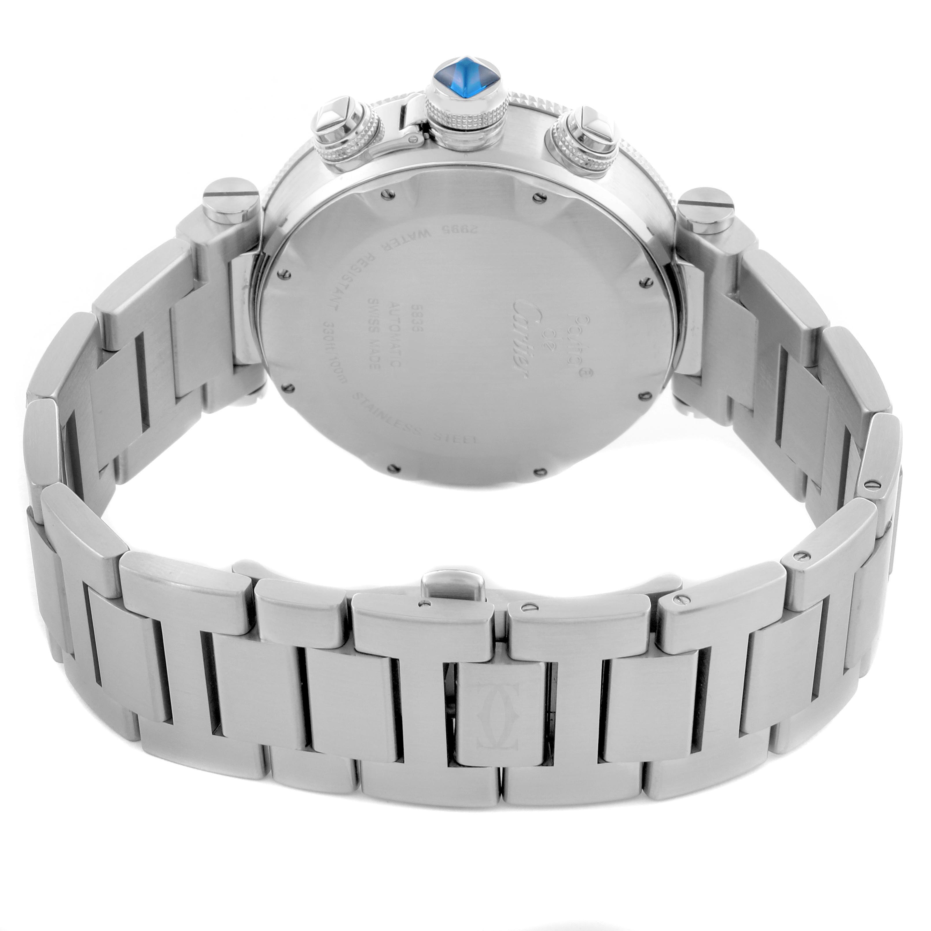 The image shows the back of a Cartier Pasha W31089M7 Men's Stainless Steel Silver Dial W31089M7 Men's Stainless Steel Silver Dial watch, highlighting the case, crown with a blue cabochon, and the metal bracelet.