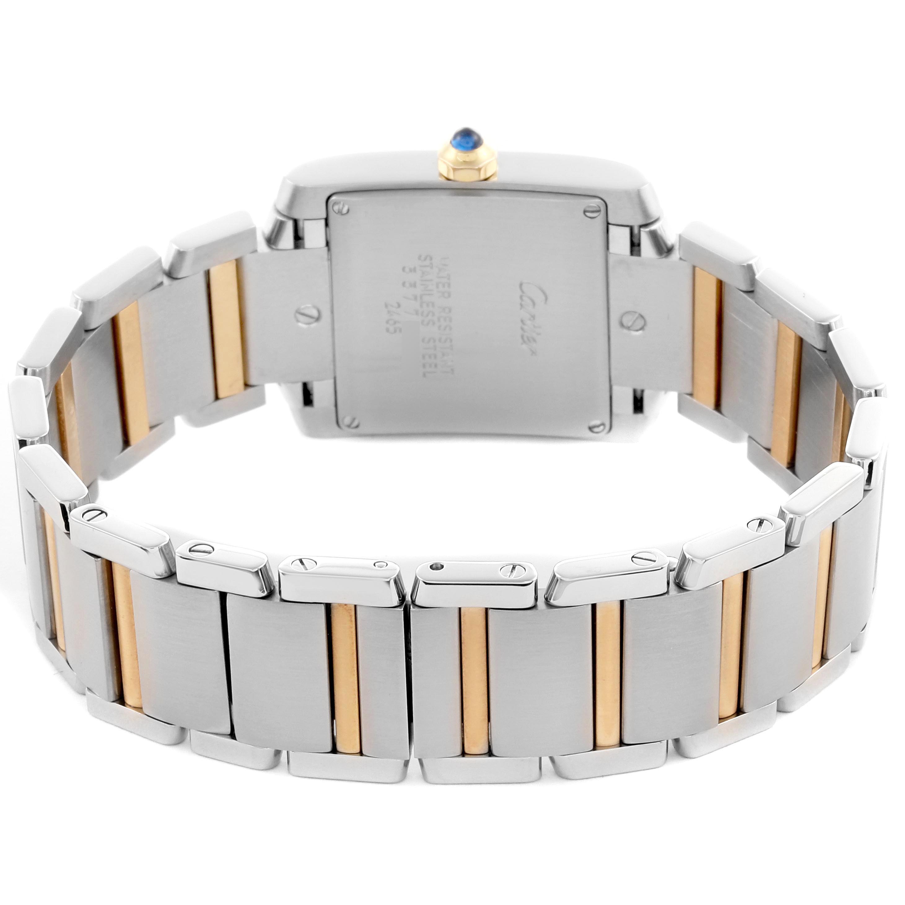 The image shows the back of the Cartier Tank Française watch, showcasing its two-tone bracelet and case back.