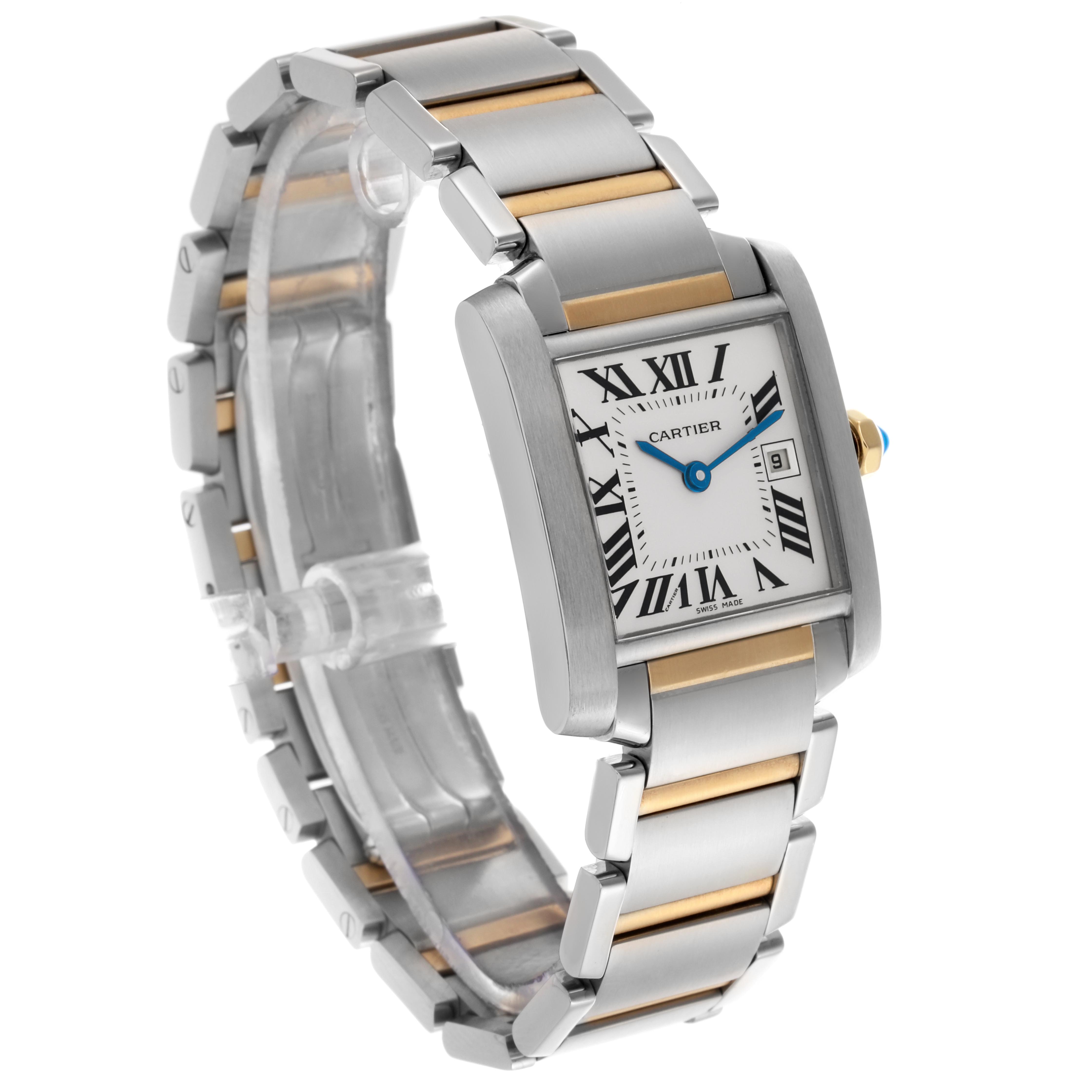 The Cartier Tank Française watch is shown at an angled side view, highlighting the silver and gold-toned bracelet and the rectangular face with Roman numerals.