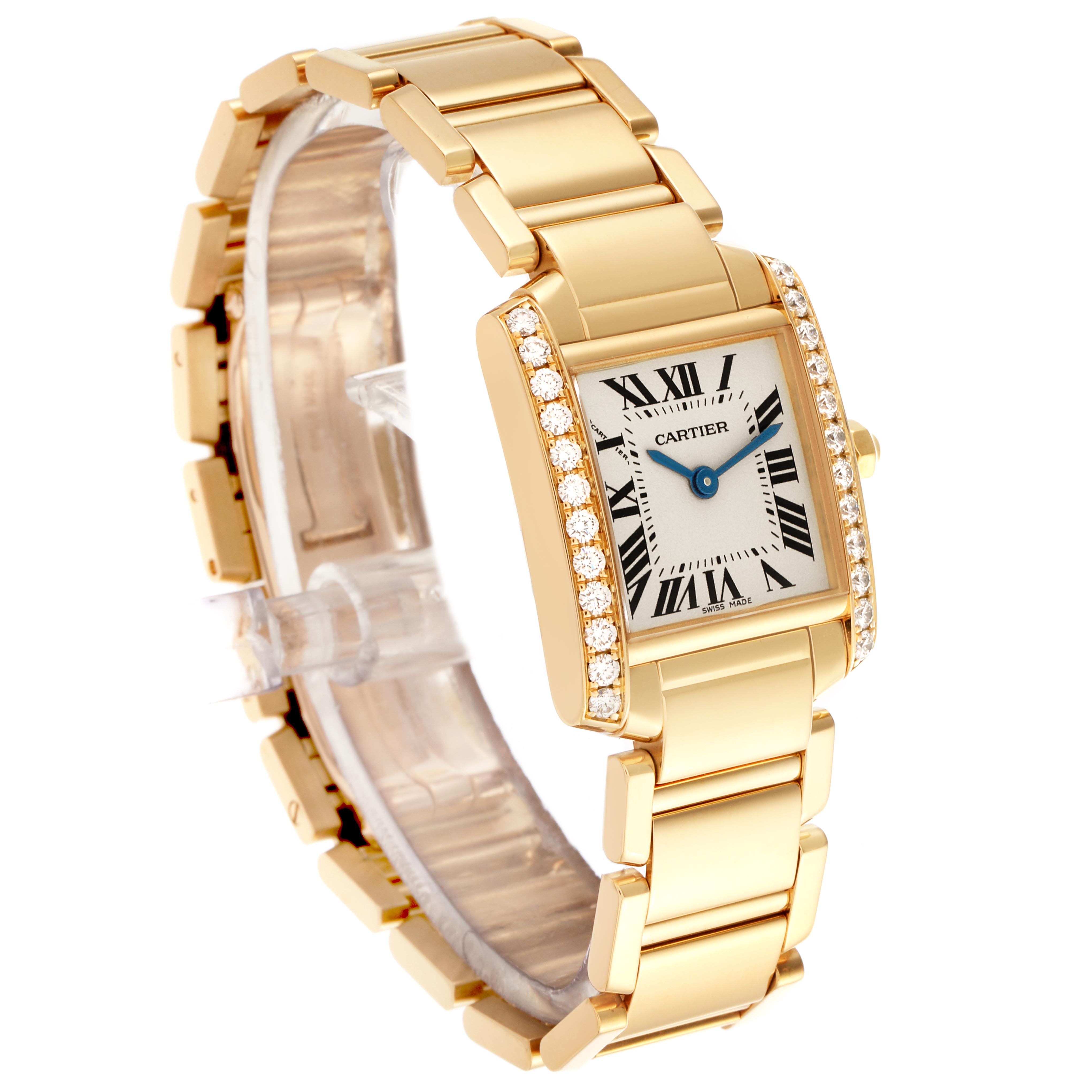 The Cartier Tank Francaise WE1001R8 Women's Yellow Gold Silver Dial WE1001R8 Women's Yellow Gold Silver Dial watch is shown at an angle highlighting its gold bracelet, diamond-set case, and Roman numeral dial.