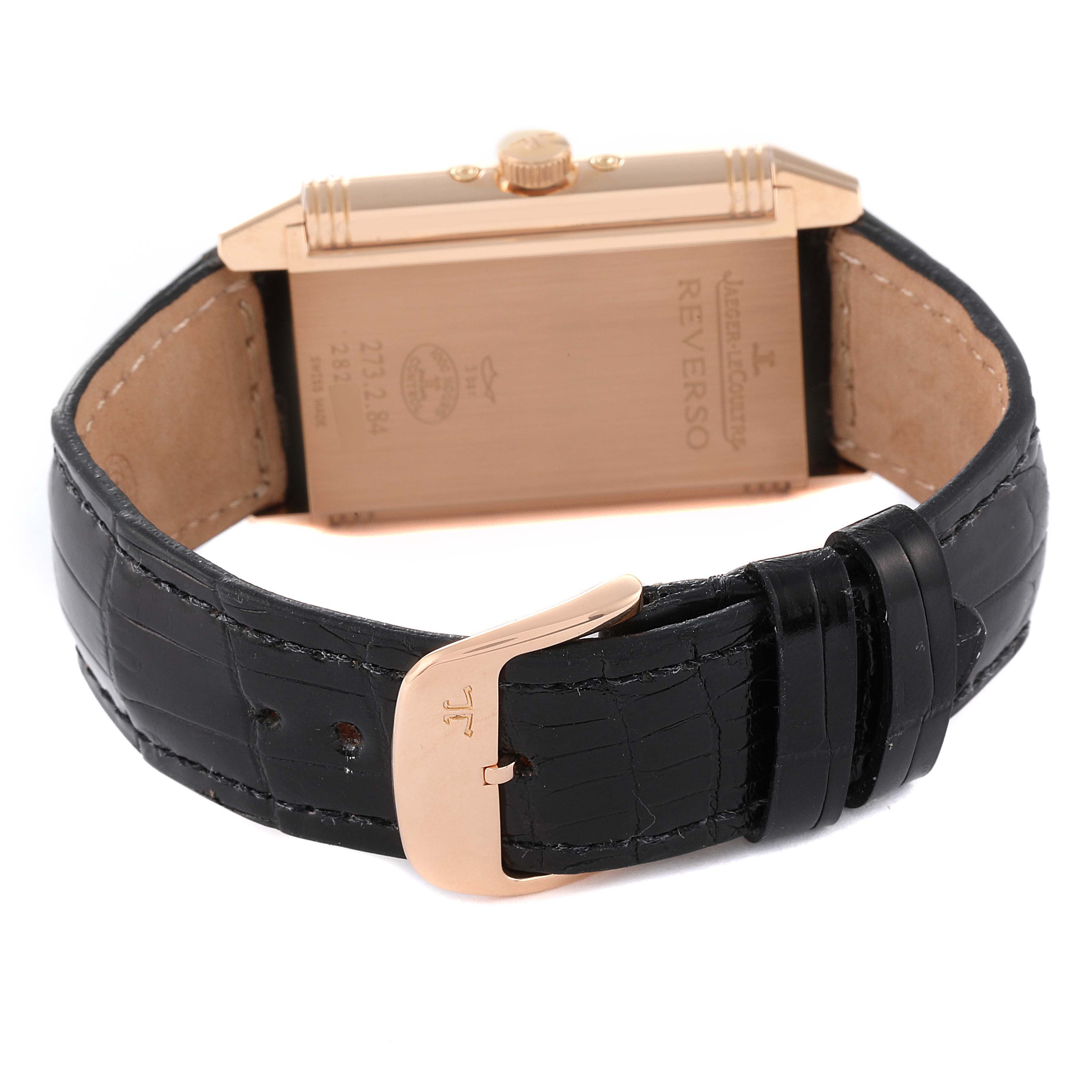 This image shows the back of a Jaeger LeCoultre Reverso Q3752520 Men
s Rose Gold Silver Dial Q3752520 Men
s Rose Gold Silver Dial watch, including its black leather strap and gold buckle.
