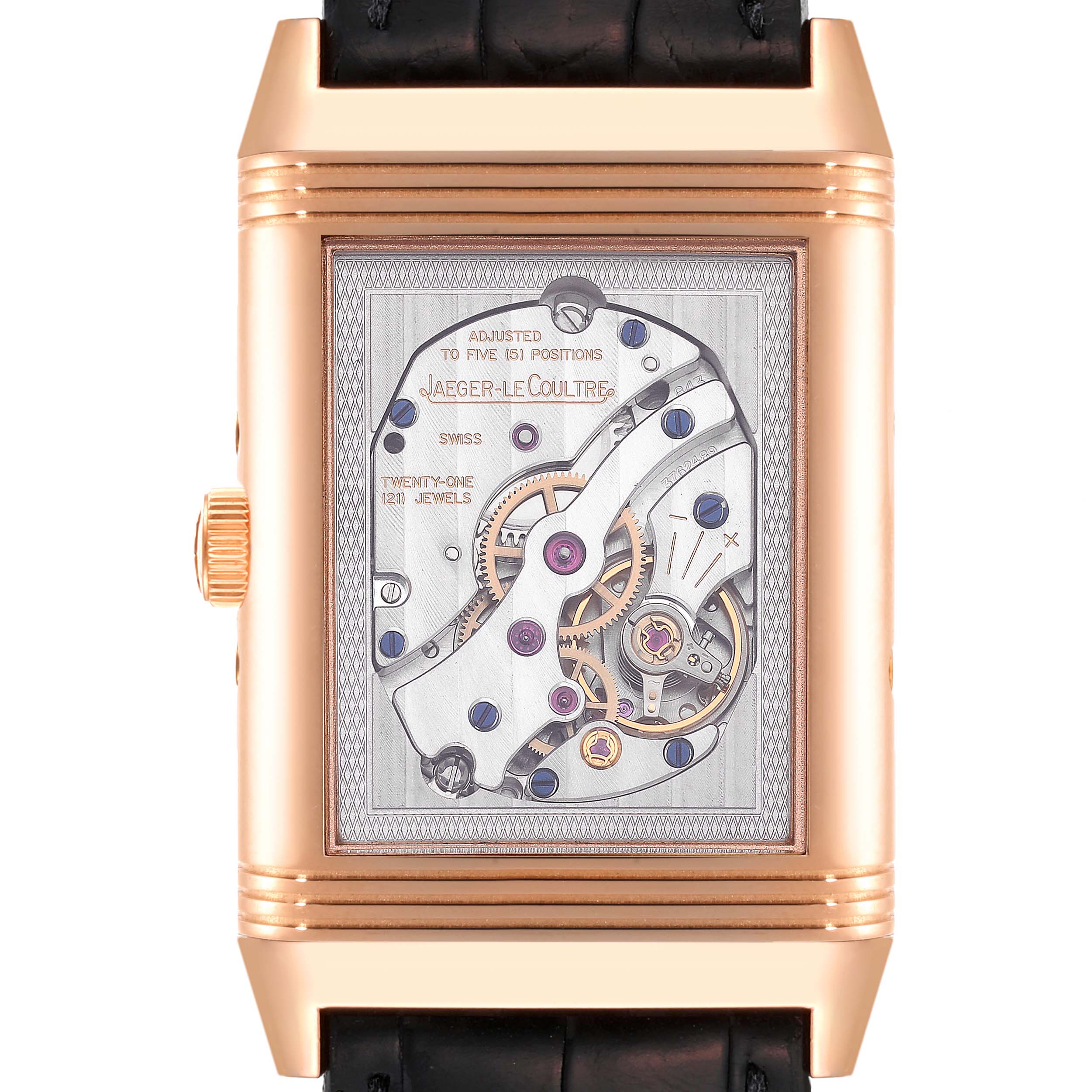 The image shows a close-up of the back view of the Jaeger-LeCoultre Reverso watch, highlighting its intricate movement and mechanics.